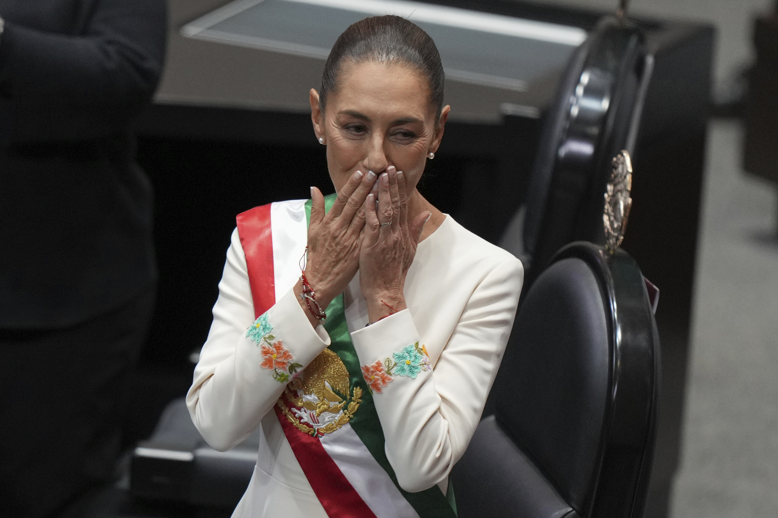 President Claudia Sheinbaum blows a kiss during her swearing-in ceremony as Mexico's new president at Congress in Mexico City, Tuesday, Oct. 1, 2024. (AP Photo/Fernando Llano)