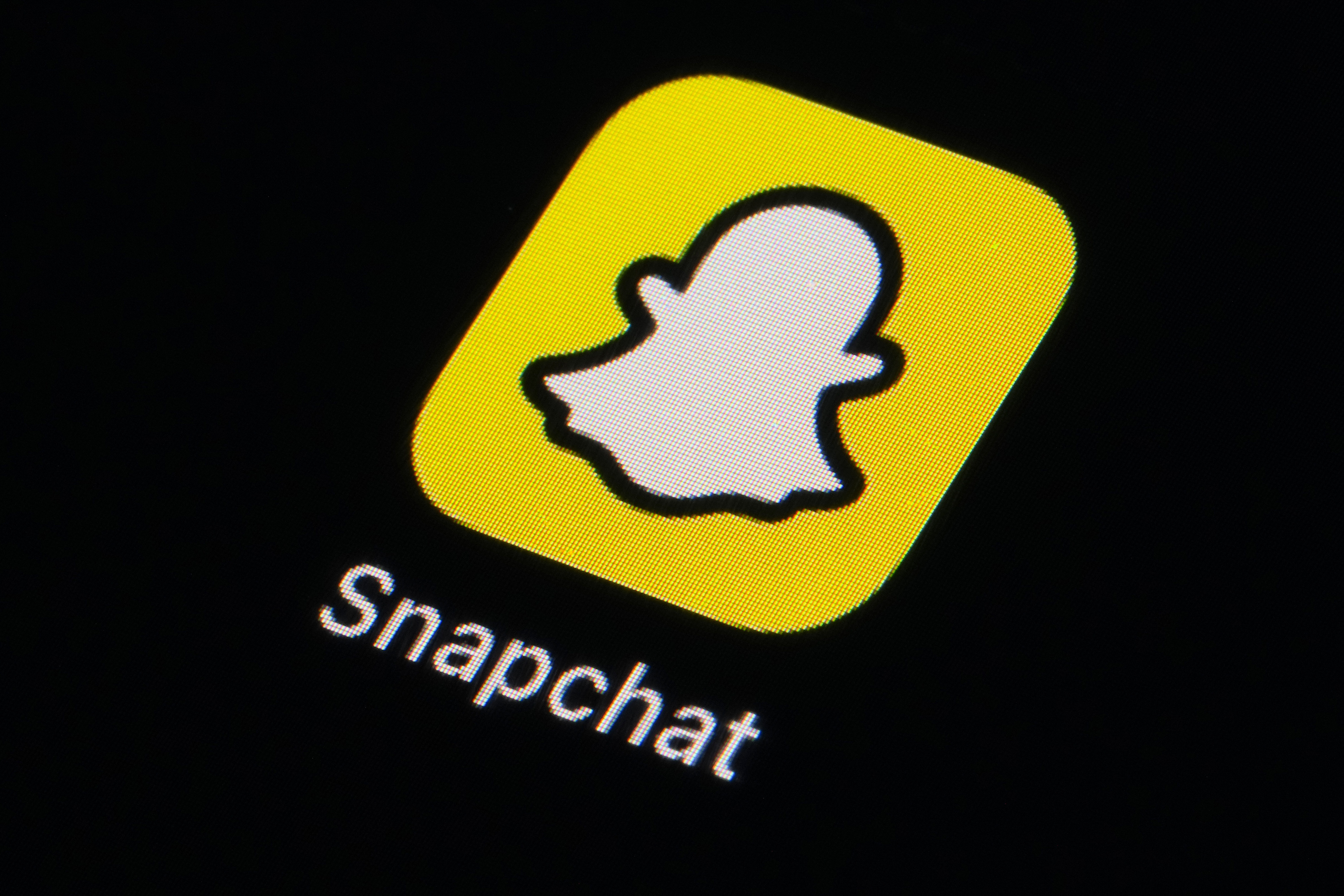 FILE - The icon for Snapchat is seen on a smartphone, Feb. 28, 2023, in Marple Township, Pa. (AP Photo/Matt Slocum, File)