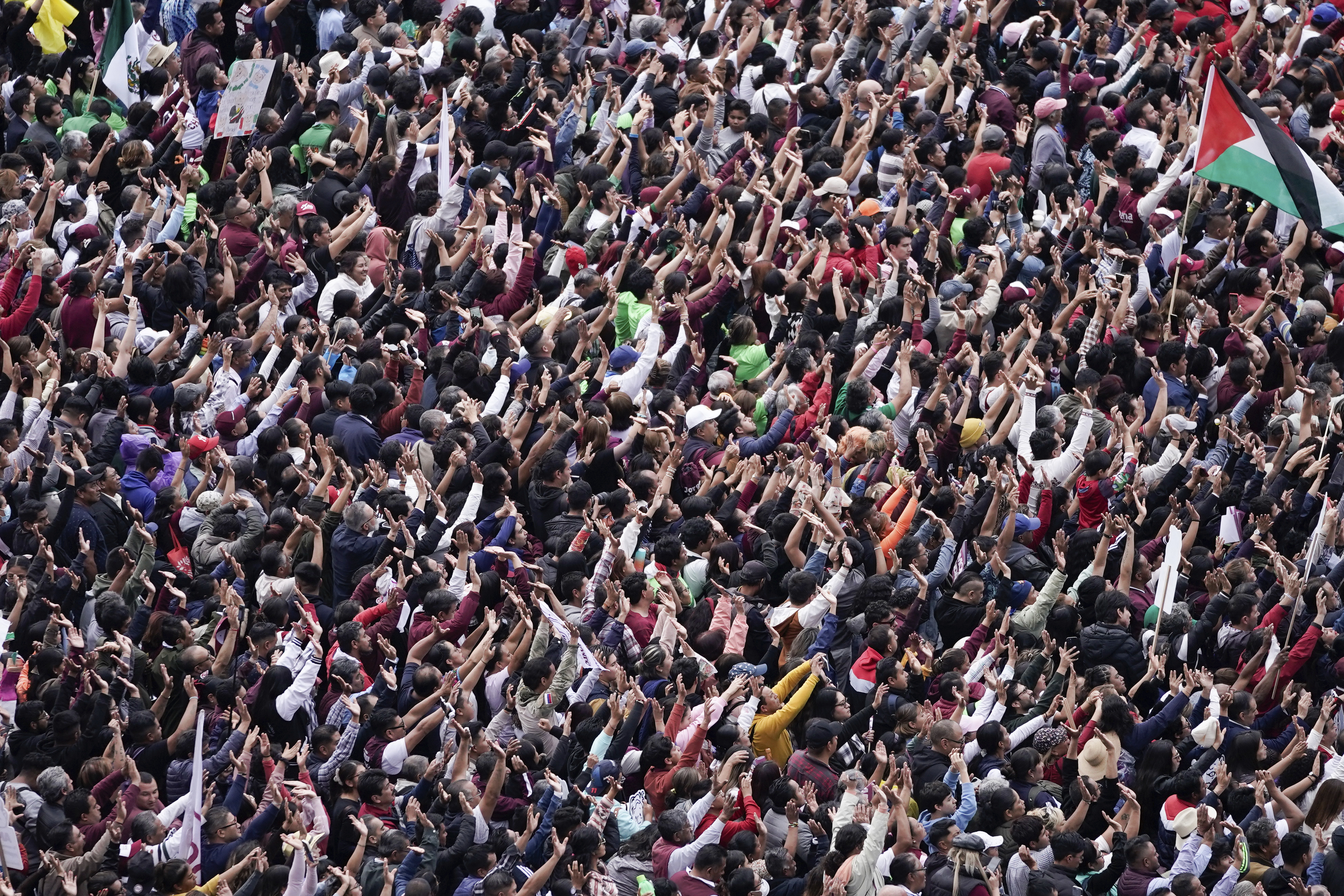 Supporters listen to President Claudia Sheinbaum during a rally in the Zócalo, Mexico City's main square, on her inauguration day, Tuesday, Oct. 1, 2024. (AP Photo/Aurea Del Rosario)