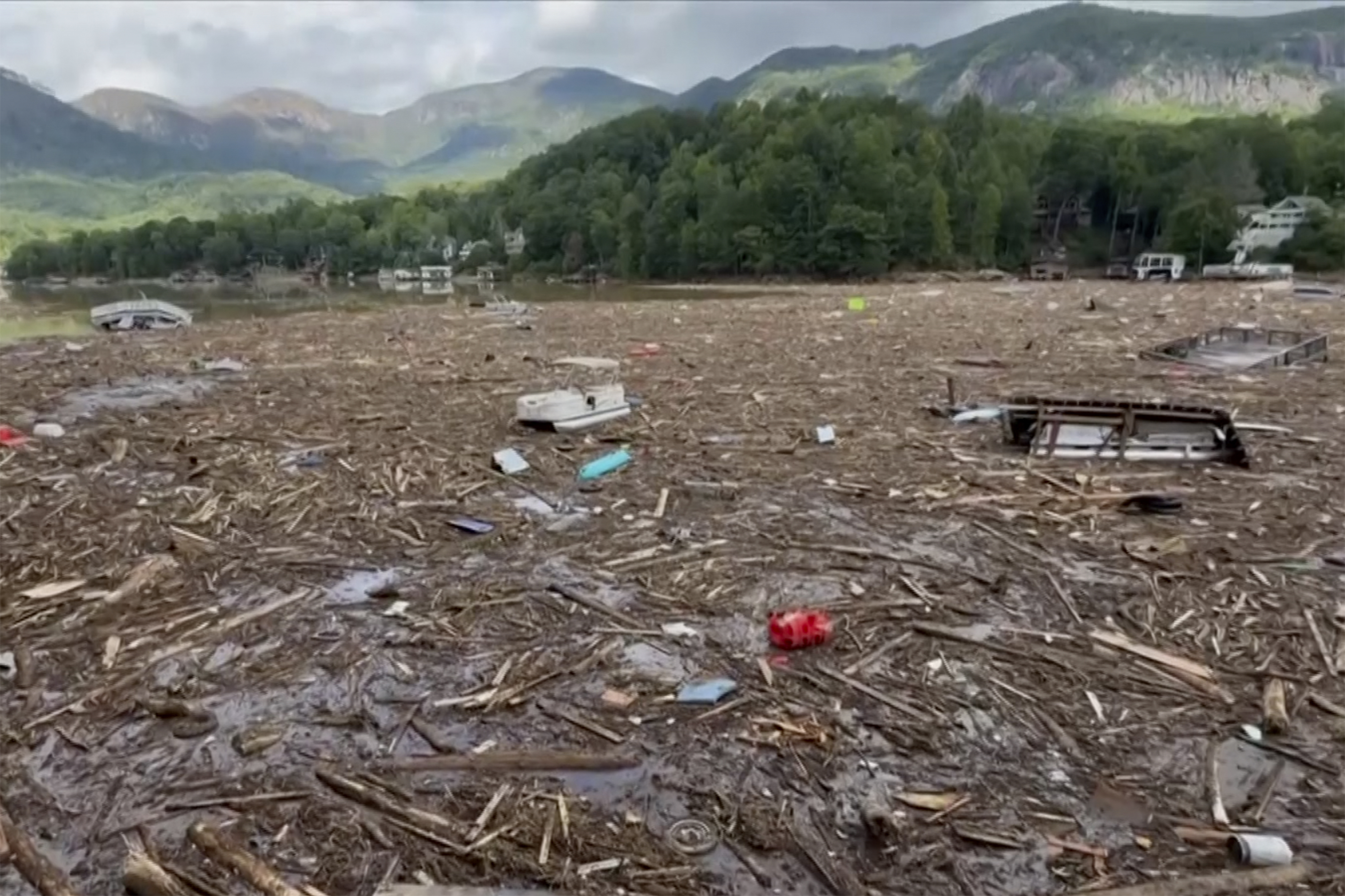 Flood debris from Hurricane Helene floats by in Rutherford County, N.C., Sunday, Sept. 29, 2024. (Tariq Bokhari via AP)