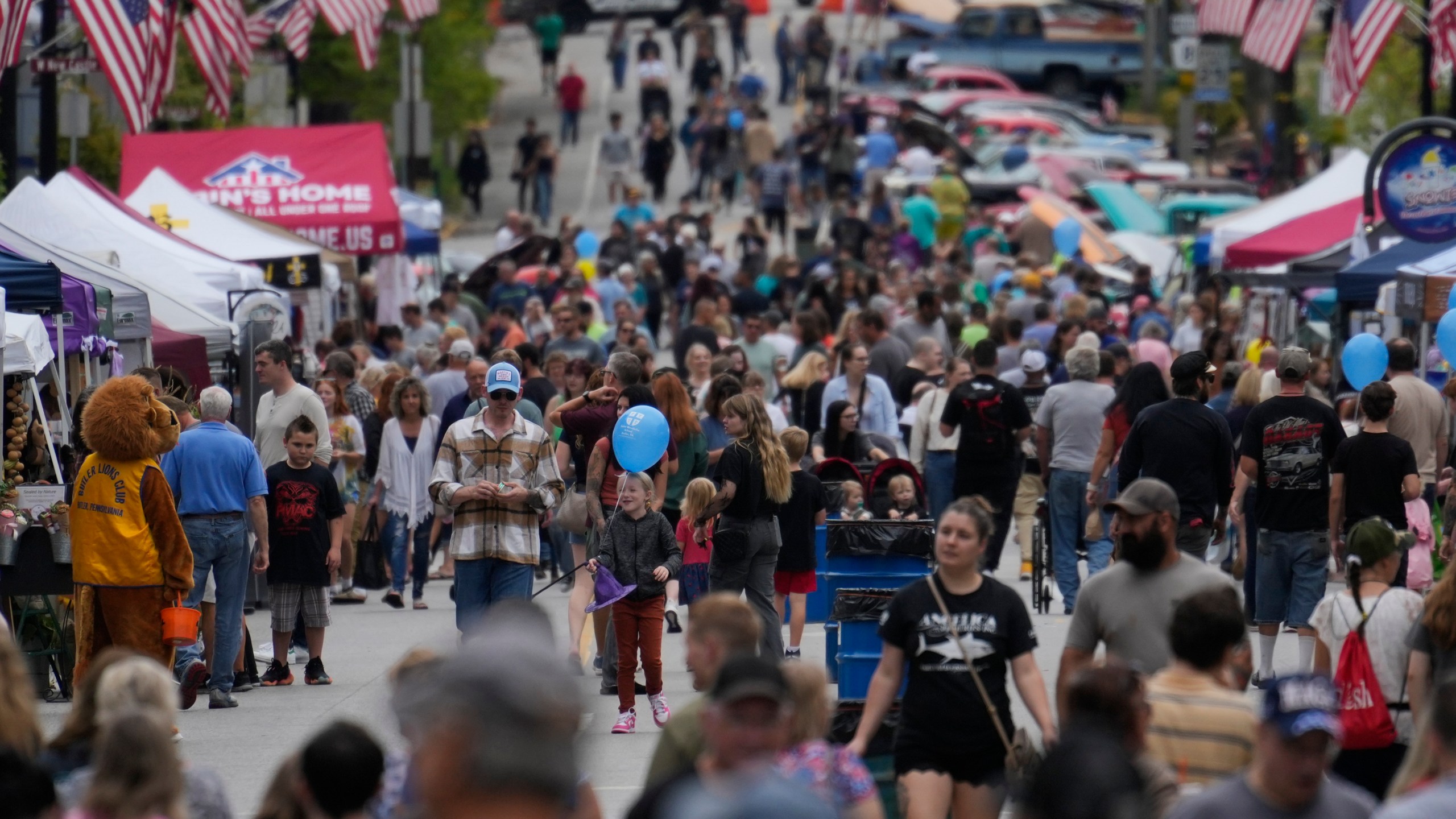 People attend the Butler Fall Festival in Butler, Saturday, Sept. 28, 2024. (AP Photo/Matt Rourke)