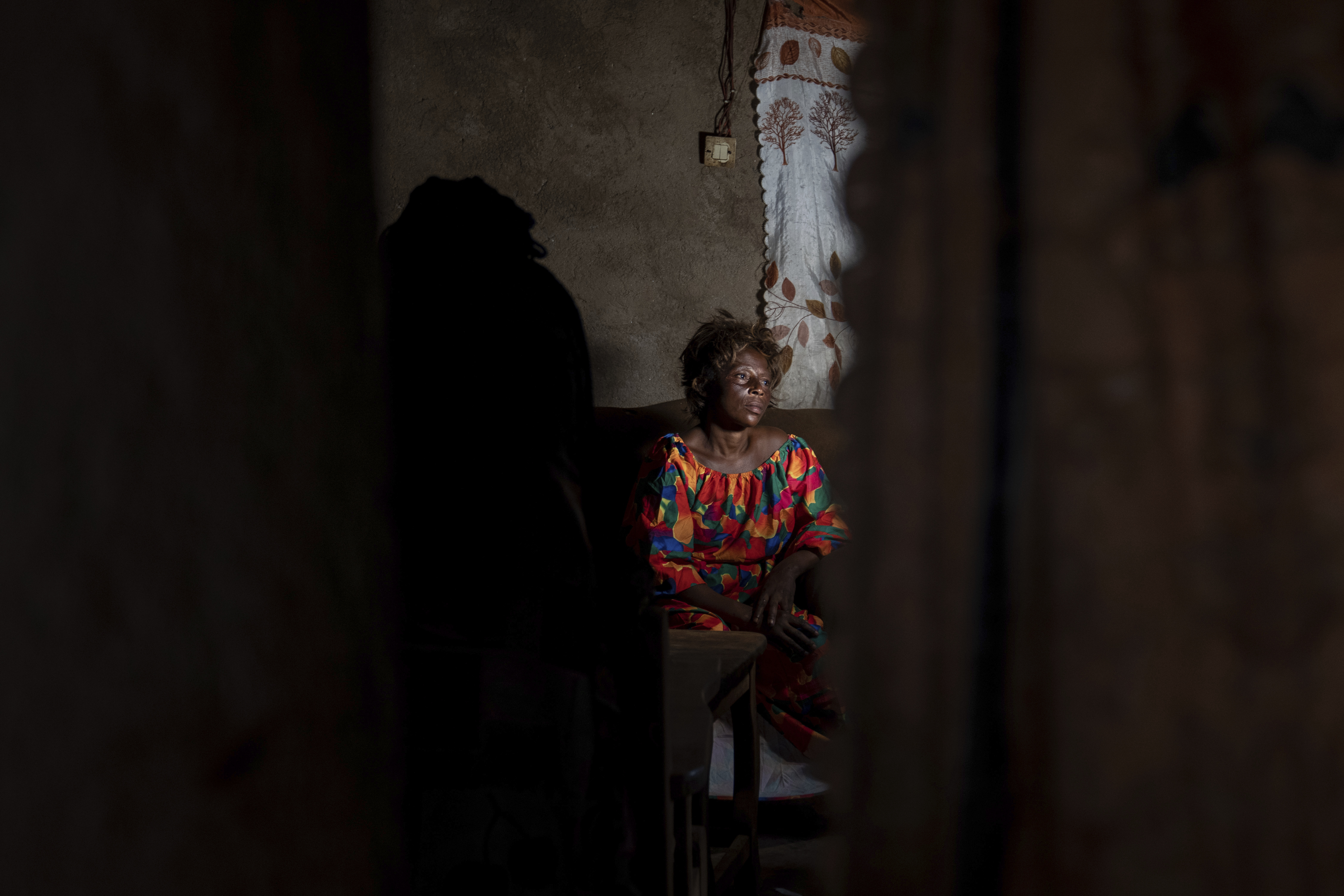 Sifa Kunguja, a 40-year-old sex worker, sits home after recovering from mpox, Wednesday, Sept. 4, 2024, in Kamituga, eastern Congo. (AP Photo/Moses Sawasawa)