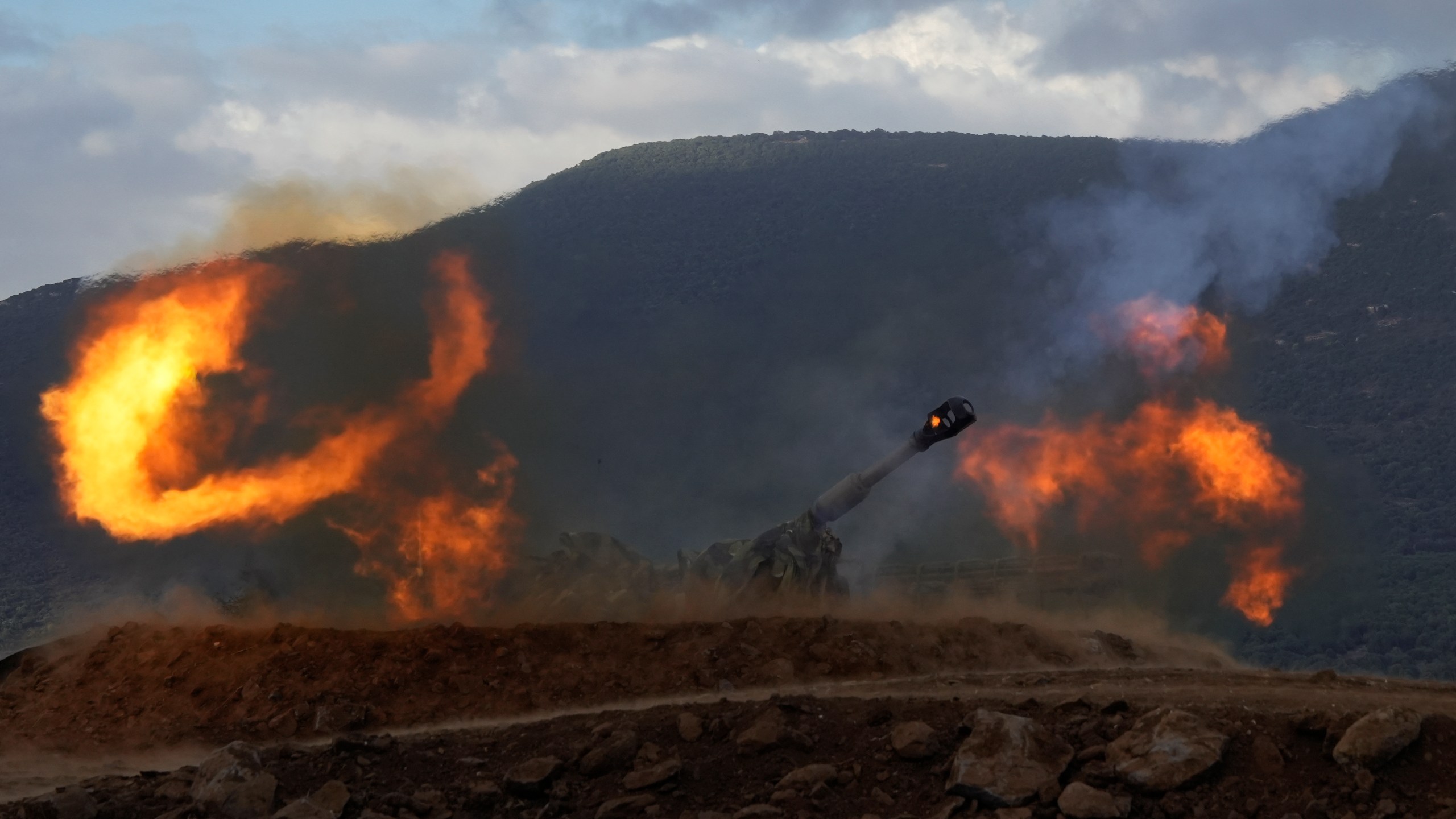 An Israeli mobile artillery unit fires a shell from northern Israel towards Lebanon, Wednesday, Oct. 2, 2024. (AP Photo/Baz Ratner)