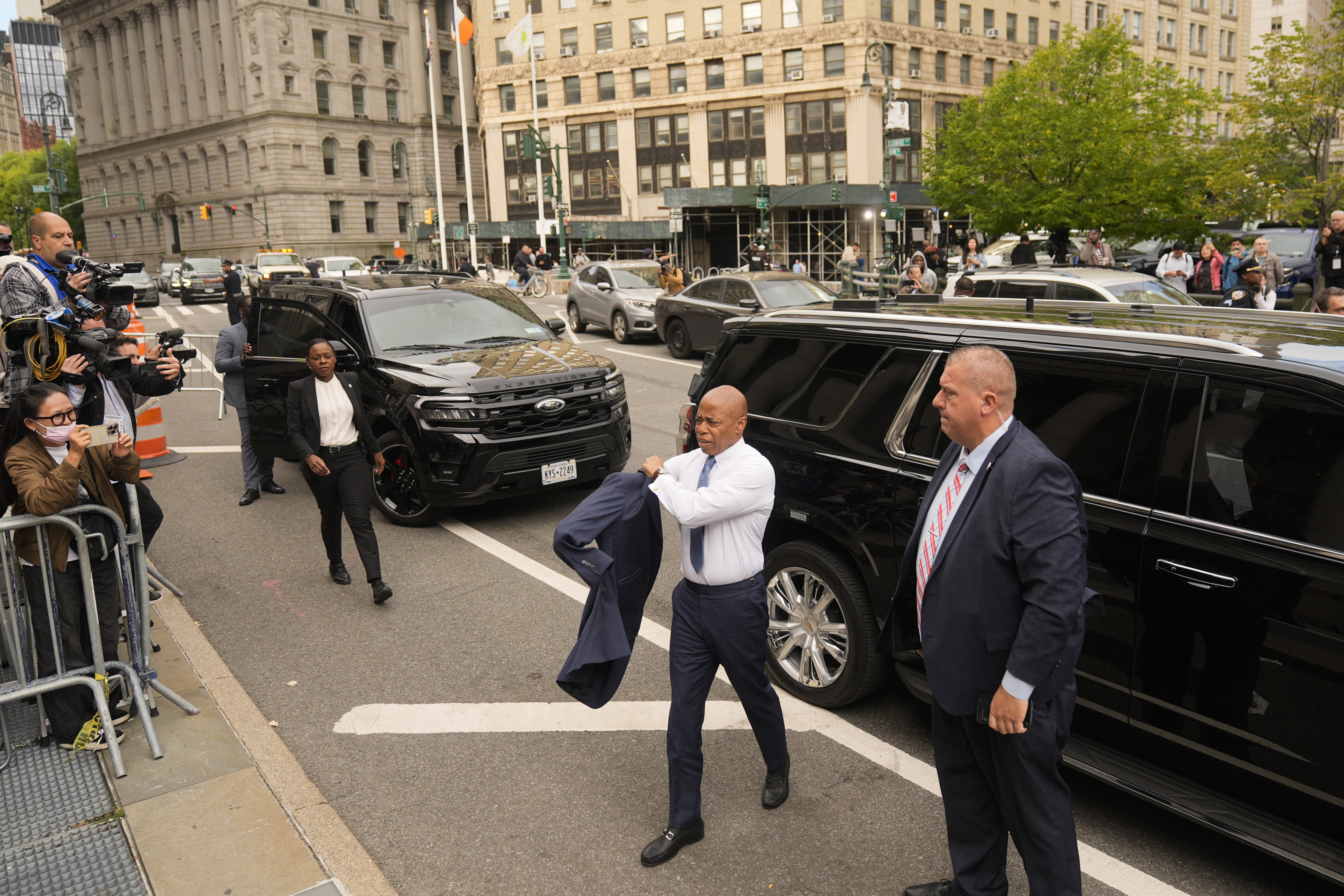 New York City Mayor Eric Adams, second from right, arrives to court in New York, Wednesday, Oct. 2, 2024. (AP Photo/Seth Wenig)