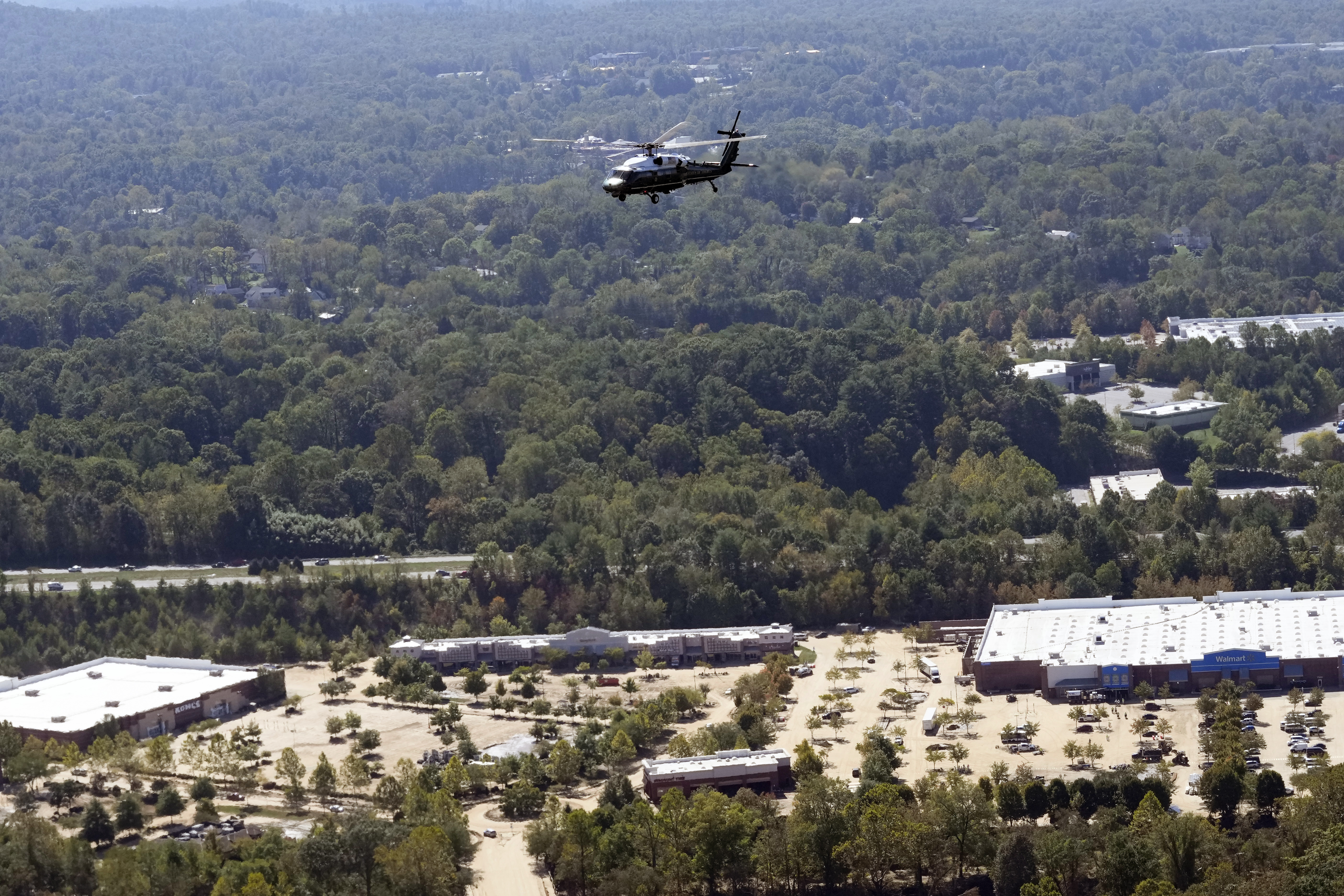 Marine One, with President Joe Biden on board, flies over areas impacted by Hurricane Helene over downtown Asheville, N.C., Wednesday, Oct. 2, 2024. (AP Photo/Susan Walsh) (AP Photo/Susan Walsh)