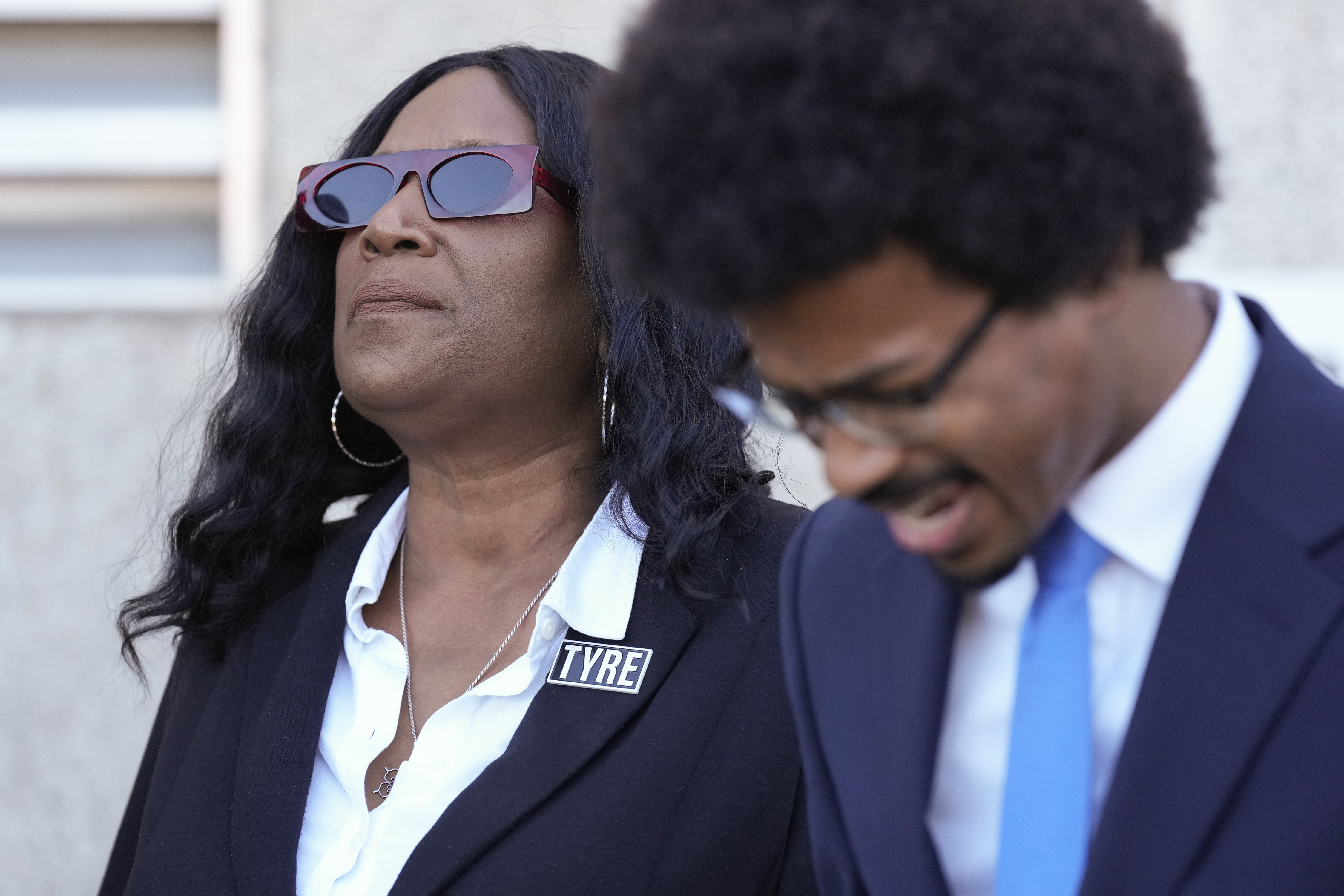 RowVaughn Wells, left, mother of Tyre Nichols, prays with Rep. Justin J. Pearson, D-Memphis, right, before entering the federal courthouse for the trial of three former Memphis police officers charged in the 2023 fatal beating of her son Wednesday, Oct. 2, 2024, in Memphis, Tenn. (AP Photo/George Walker IV)