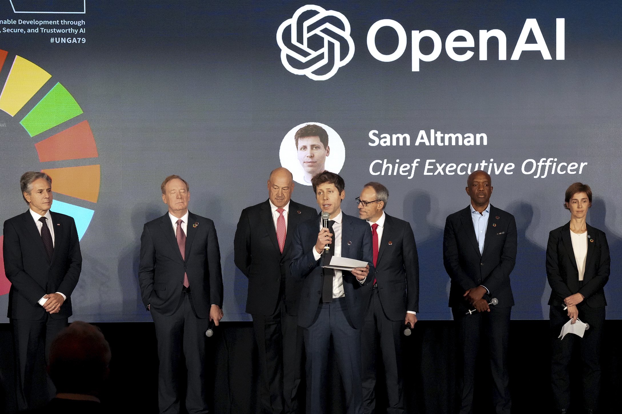 FILE - Open AI Chief Executive Officer Sam Altman, center, speaks at the Advancing Sustainable Development through Safe, Secure, and Trustworthy AI Event on Sept. 23, 204, in New York. (Bryan R. Smith/Pool Photo via AP, File)