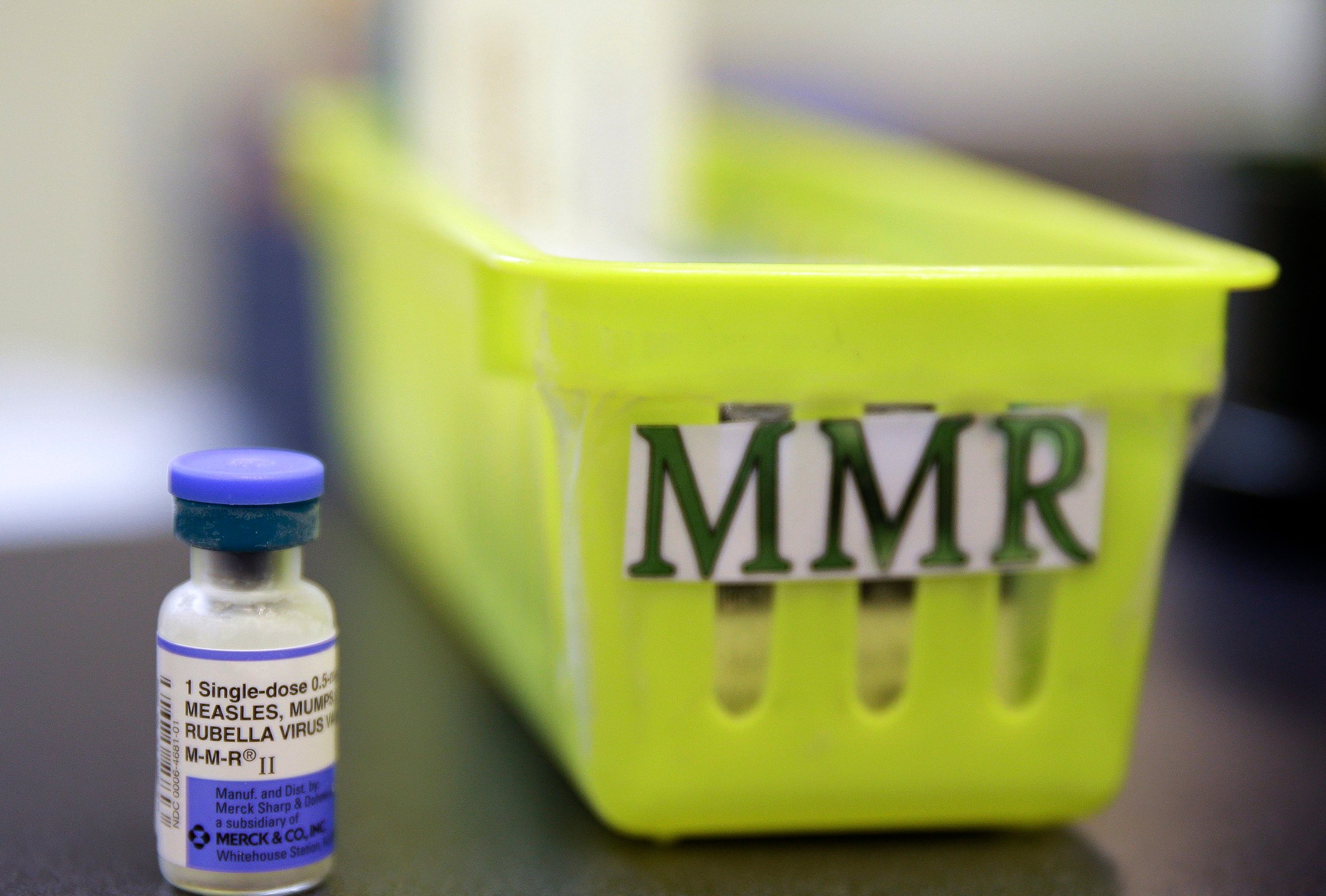 FILE - A vial of a measles, mumps and rubella vaccine sits on a countertop at a pediatrics clinic in Greenbrae, Calif., on Feb. 6, 2015. (AP Photo/Eric Risberg, File)