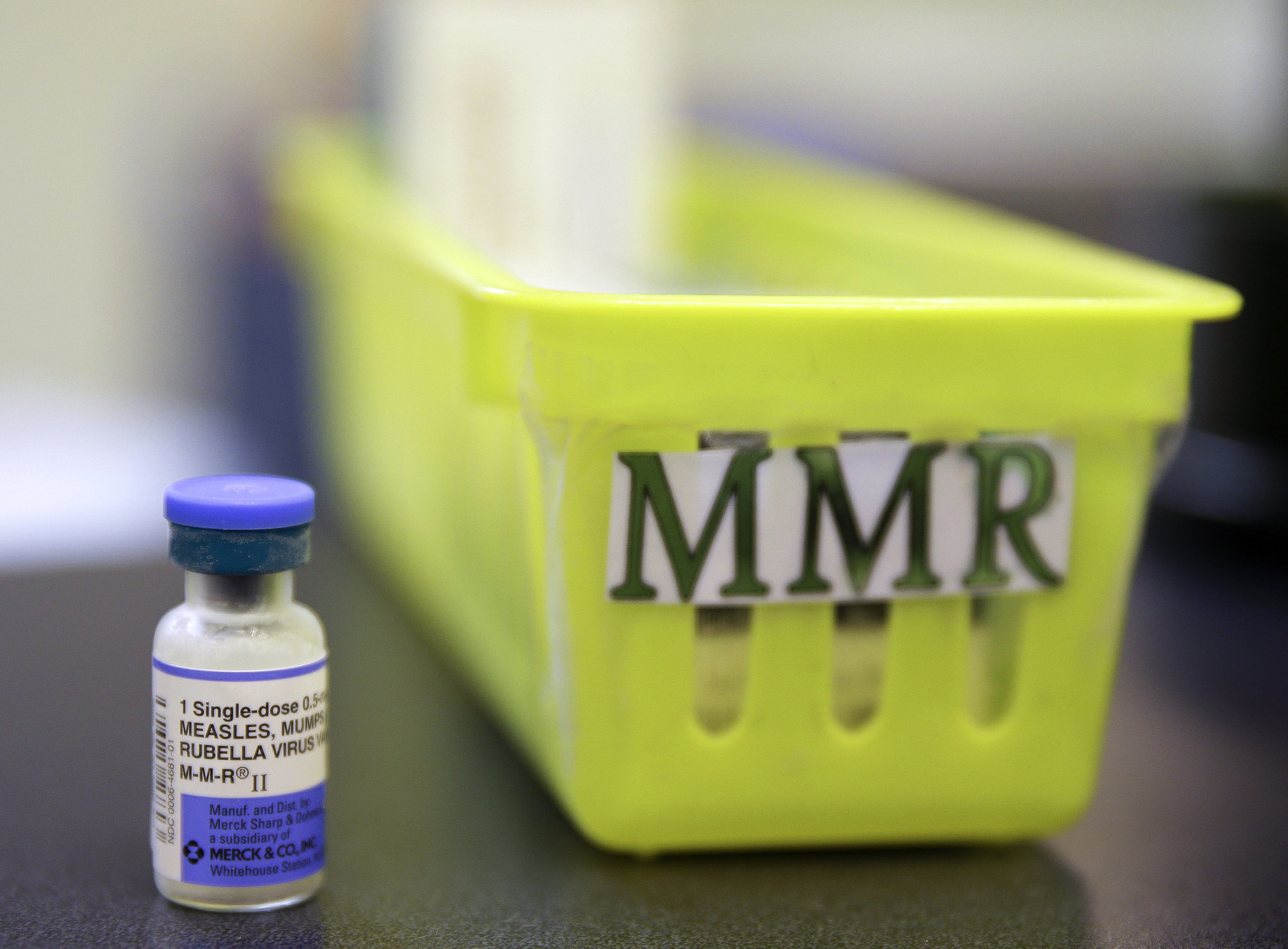 FILE - A vial of a measles, mumps and rubella vaccine sits on a countertop at a pediatrics clinic in Greenbrae, Calif., on Feb. 6, 2015. (AP Photo/Eric Risberg, File)