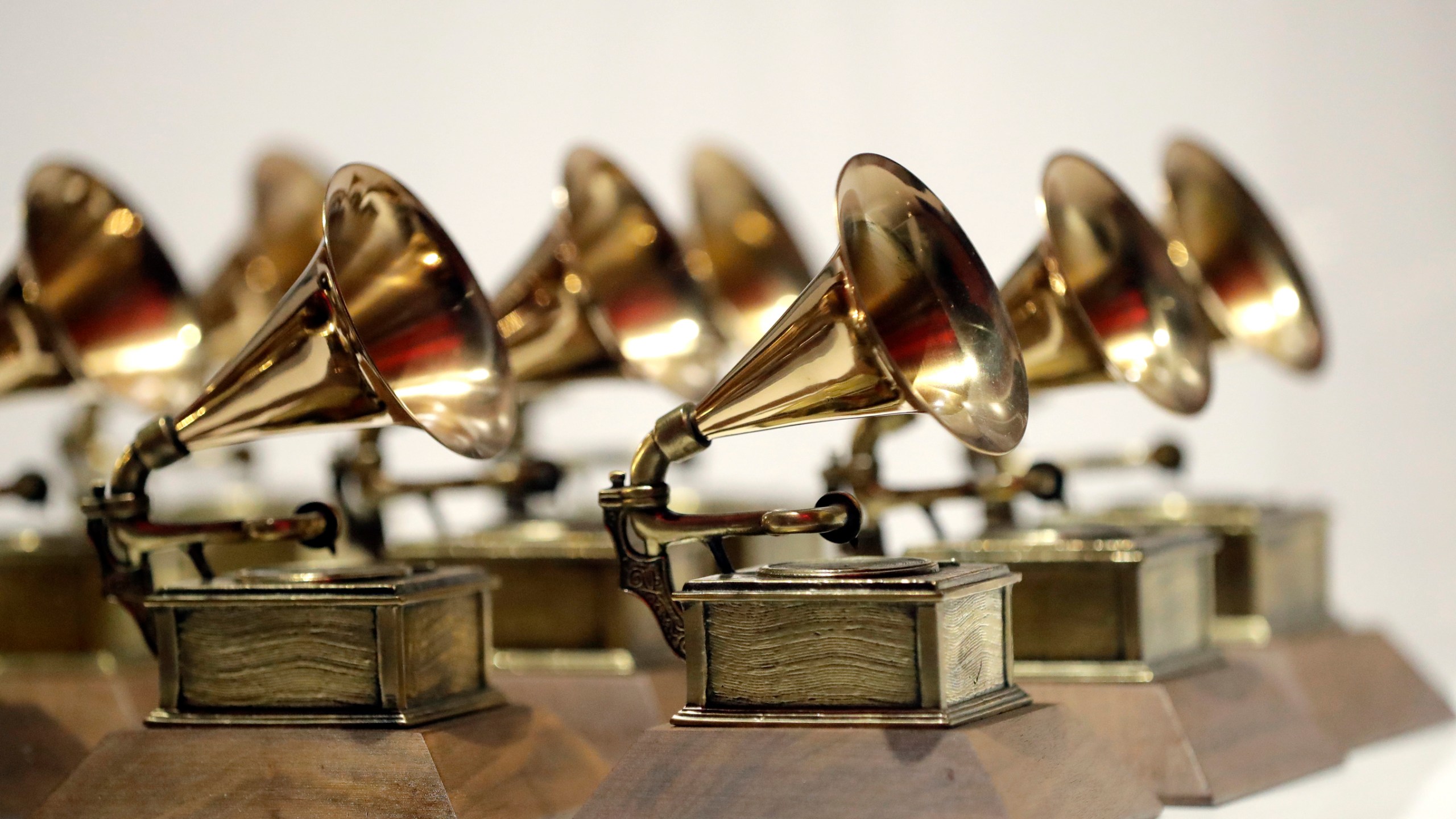 FILE - Grammy Awards are displayed at the Grammy Museum Experience at Prudential Center in Newark, N.J. on Oct. 10, 2017. (AP Photo/Julio Cortez, File)