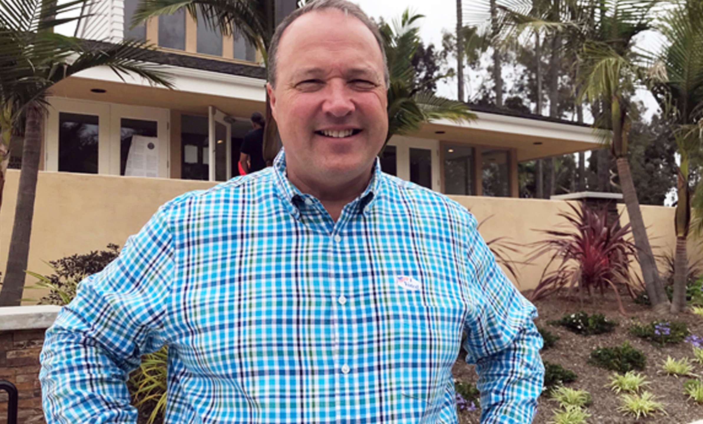 FILE - Scott Baugh, a Republican candidate for Congress from Orange County's 48th District, poses outside a polling place after voting in Huntington Beach, Calif., June 5, 2018. (AP Photo/Krysta Fauria, File)