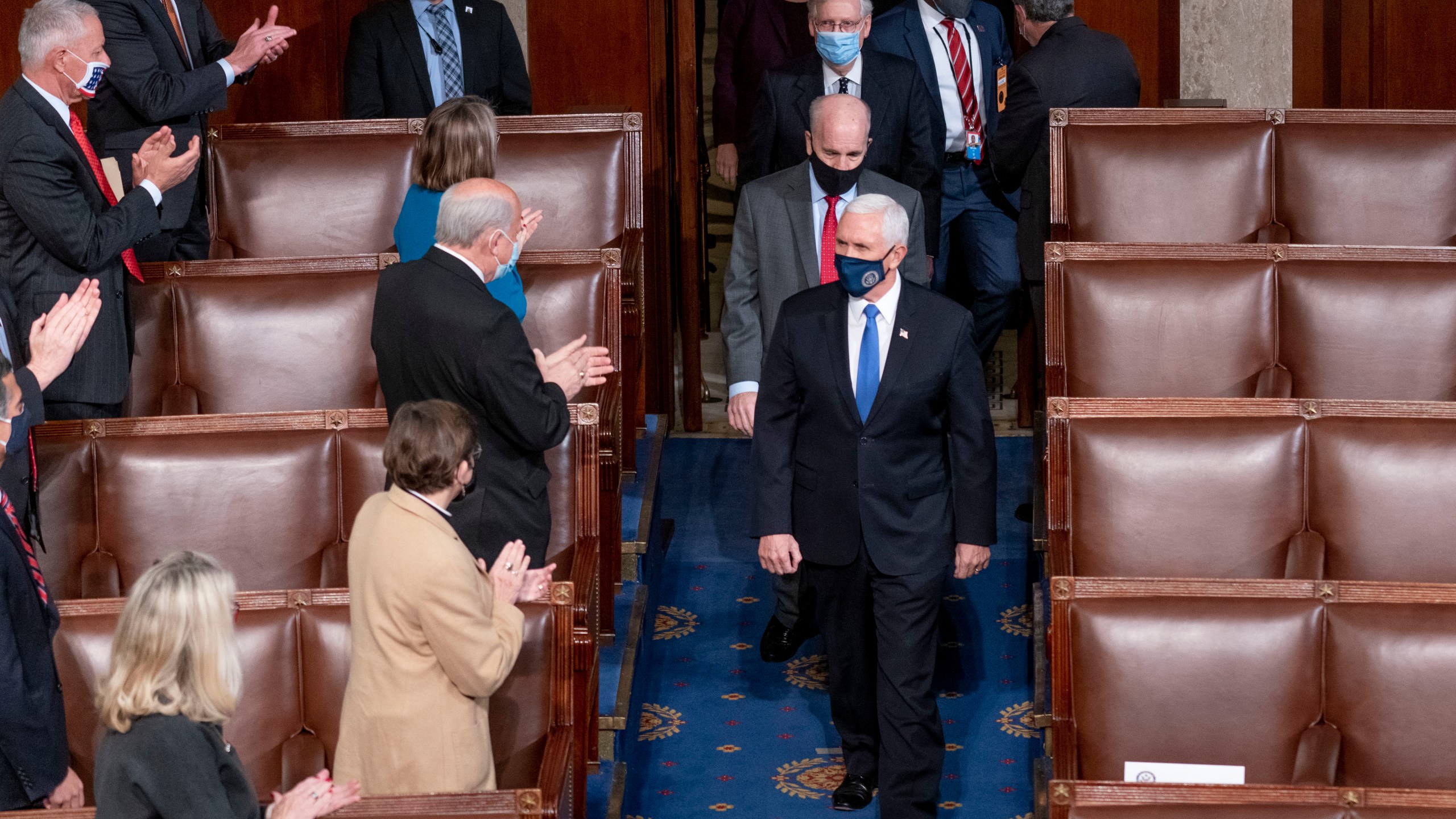 FILE - Vice President Mike Pence and Senate Majority Leader Mitch McConnell of Ky., top center, arrive along with other senators for a joint session of the House and Senate convenes to confirm the electoral votes cast in November's election, at the Capitol in Washington, Jan. 6, 2021. (AP Photo/Andrew Harnik, File)