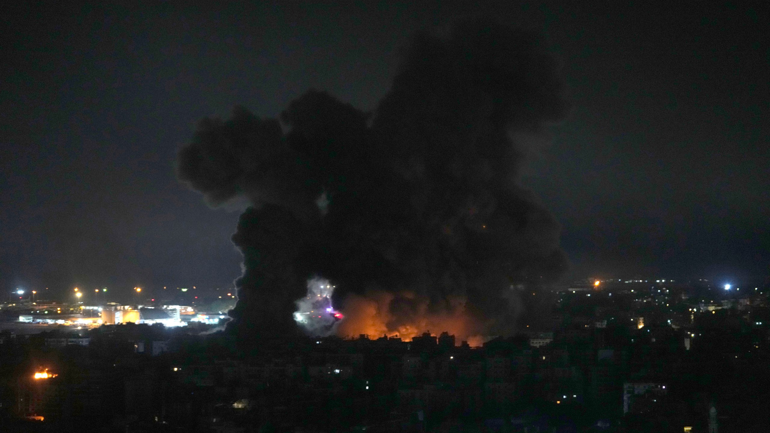 Flames and smoke rise from Israeli airstrikes in Dahiyeh, Beirut, Lebanon, Friday, Oct. 4, 2024. (AP Photo/Hussein Malla)