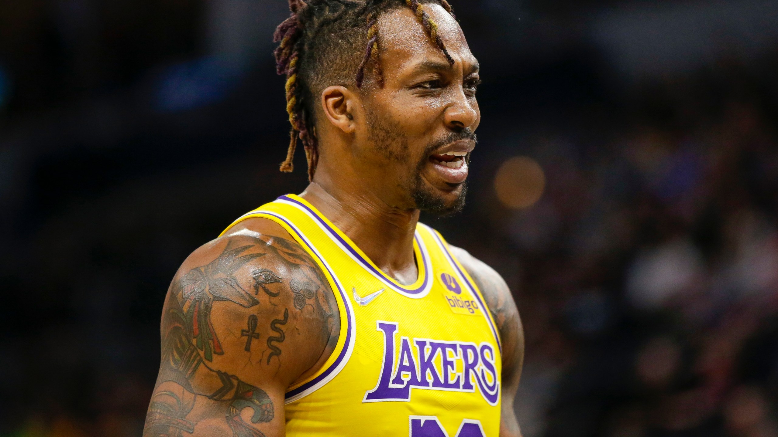 FILE - Los Angeles Lakers center Dwight Howard looks on during an NBA basketball game against the Minnesota Timberwolves, March 16, 2022, in Minneapolis. (AP Photo/Andy Clayton-King, File)