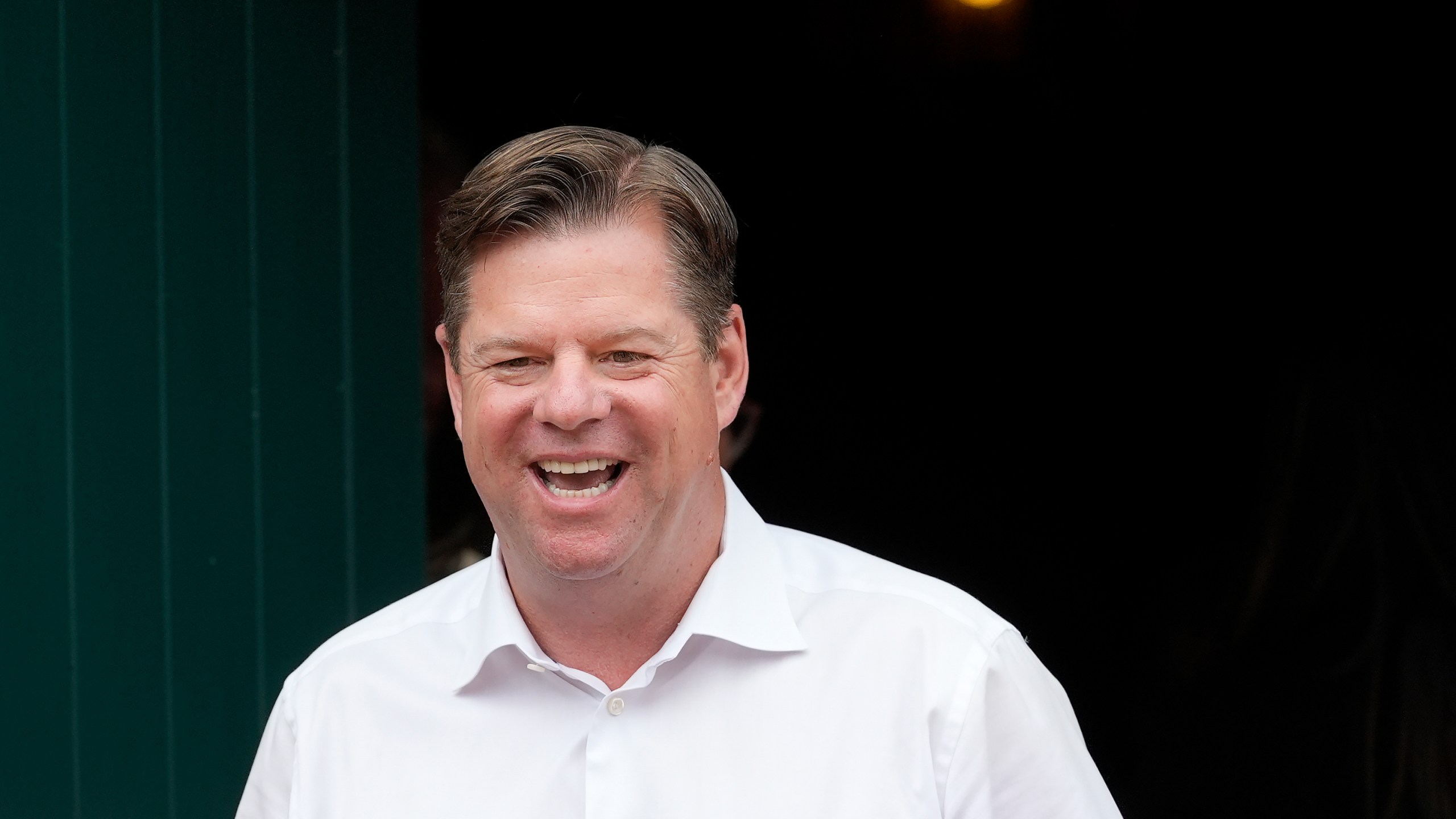 FILE - San Francisco mayoral candidate Mark Farrell smiles while meeting with people at a neighborhood event in San Francisco, Saturday, Sept. 21, 2024. (AP Photo/Jeff Chiu, File)