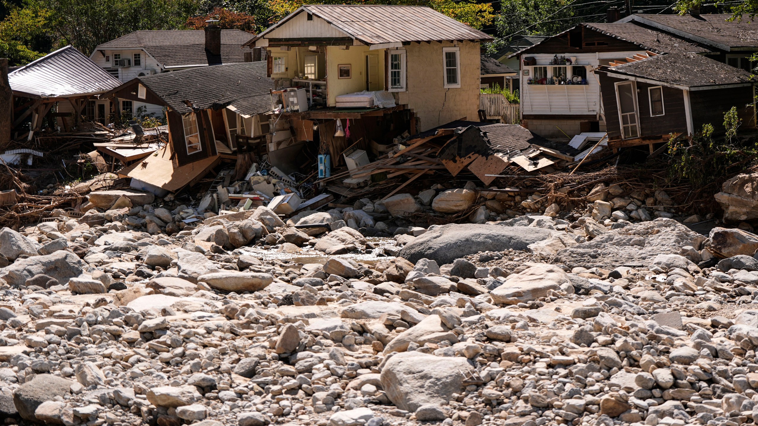 Homes are seen in the aftermath of Hurricane Helene, Wednesday, Oct. 2, 2024, in Chimney Rock Village, N.C. (AP Photo/Mike Stewart)