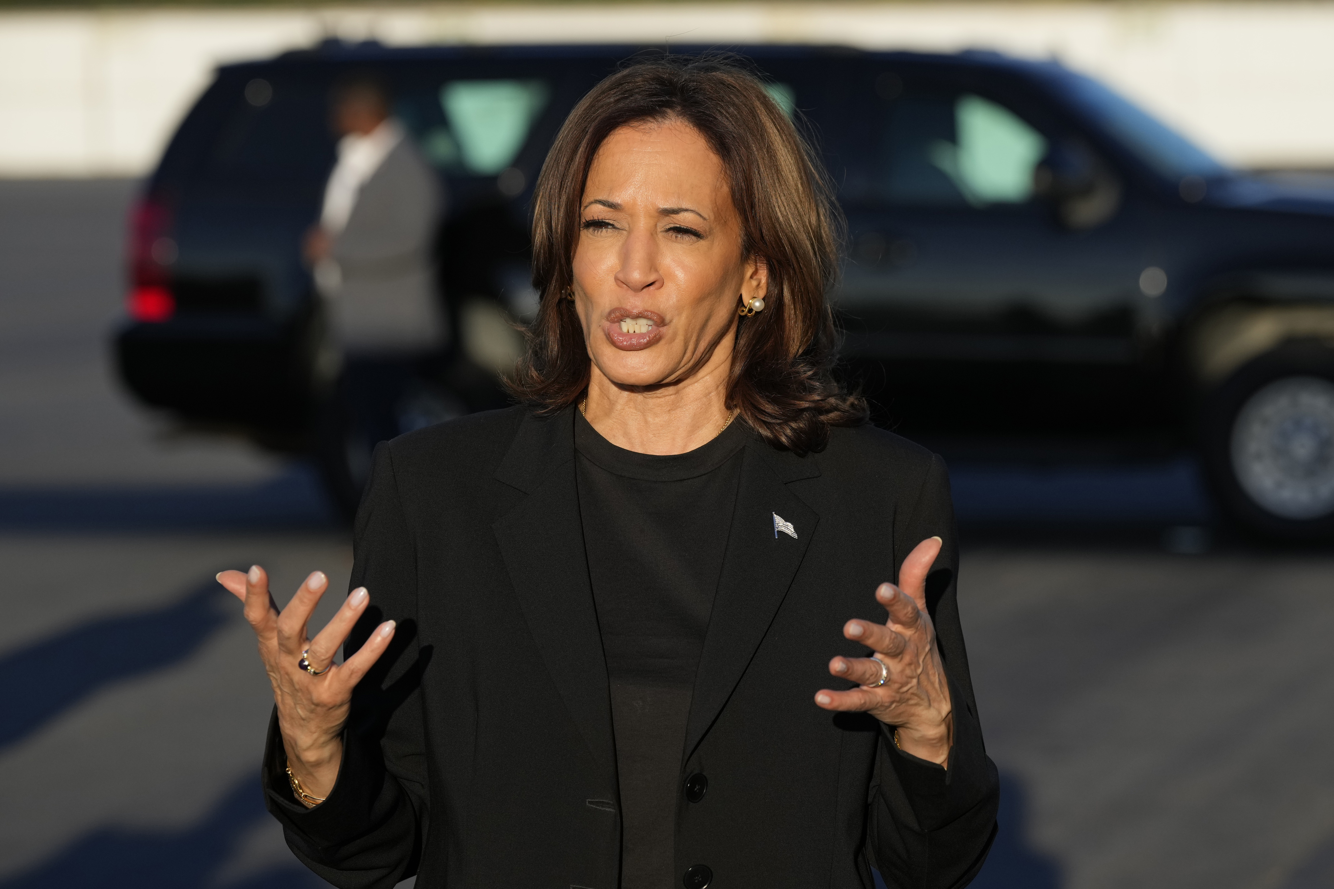 Democratic presidential nominee Vice President Kamala Harris speaks to reporters before boarding Air Force Two at Charlotte Douglas International Airport, Saturday, October 5, 2024, in Charlotte, N.C., after a briefing on the damage from Hurricane Helene. (AP Photo/Chris Carlson)