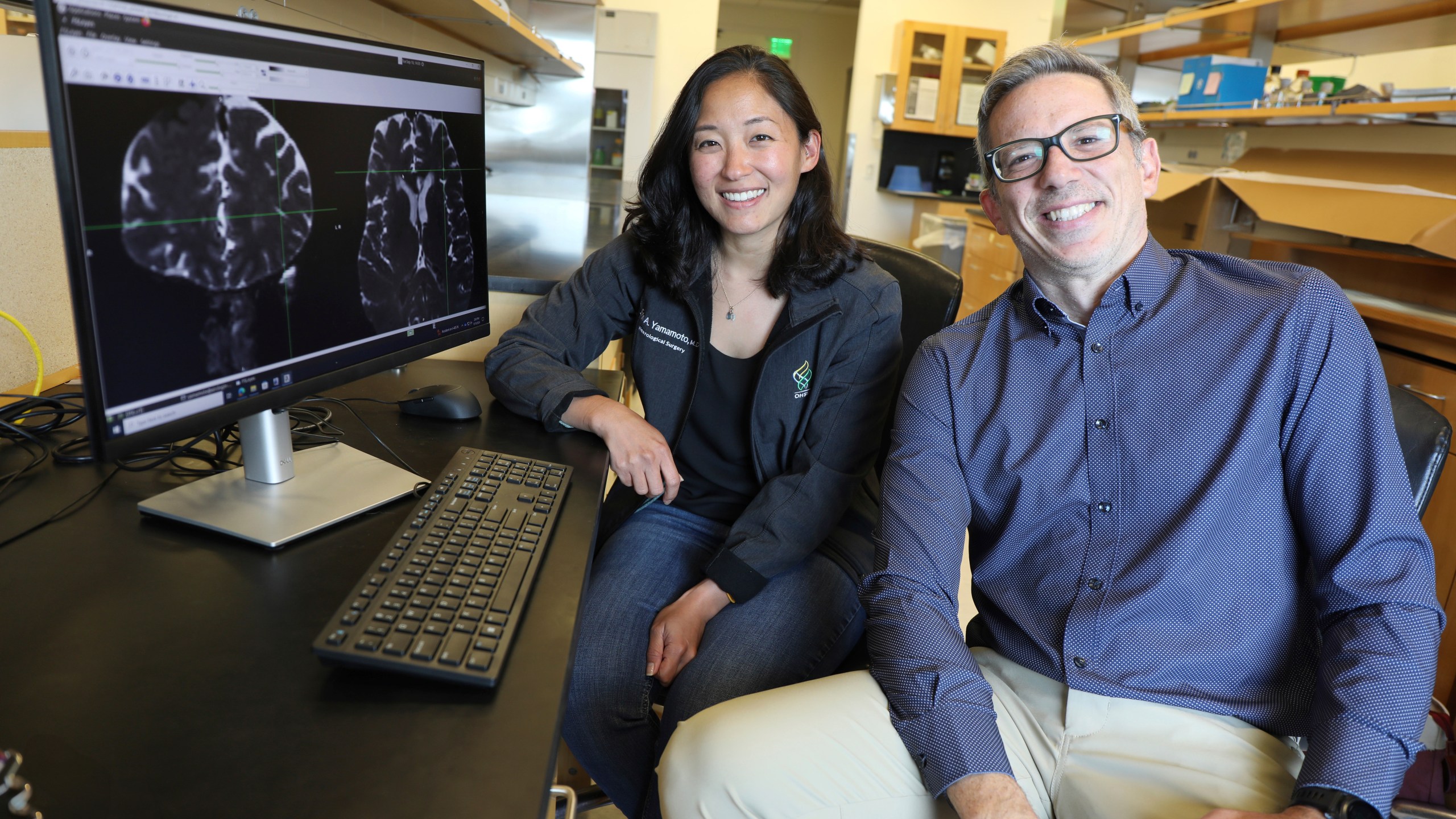 This undated photo provided by the Oregon Health & Science University in October 2024 shows Drs. Erin Yamamoto, left, and Juan Piantino, who used special imaging to spot a long-suspected pathway the human brain uses to clear waste. (Christine Torres Hicks/OHSU via AP)