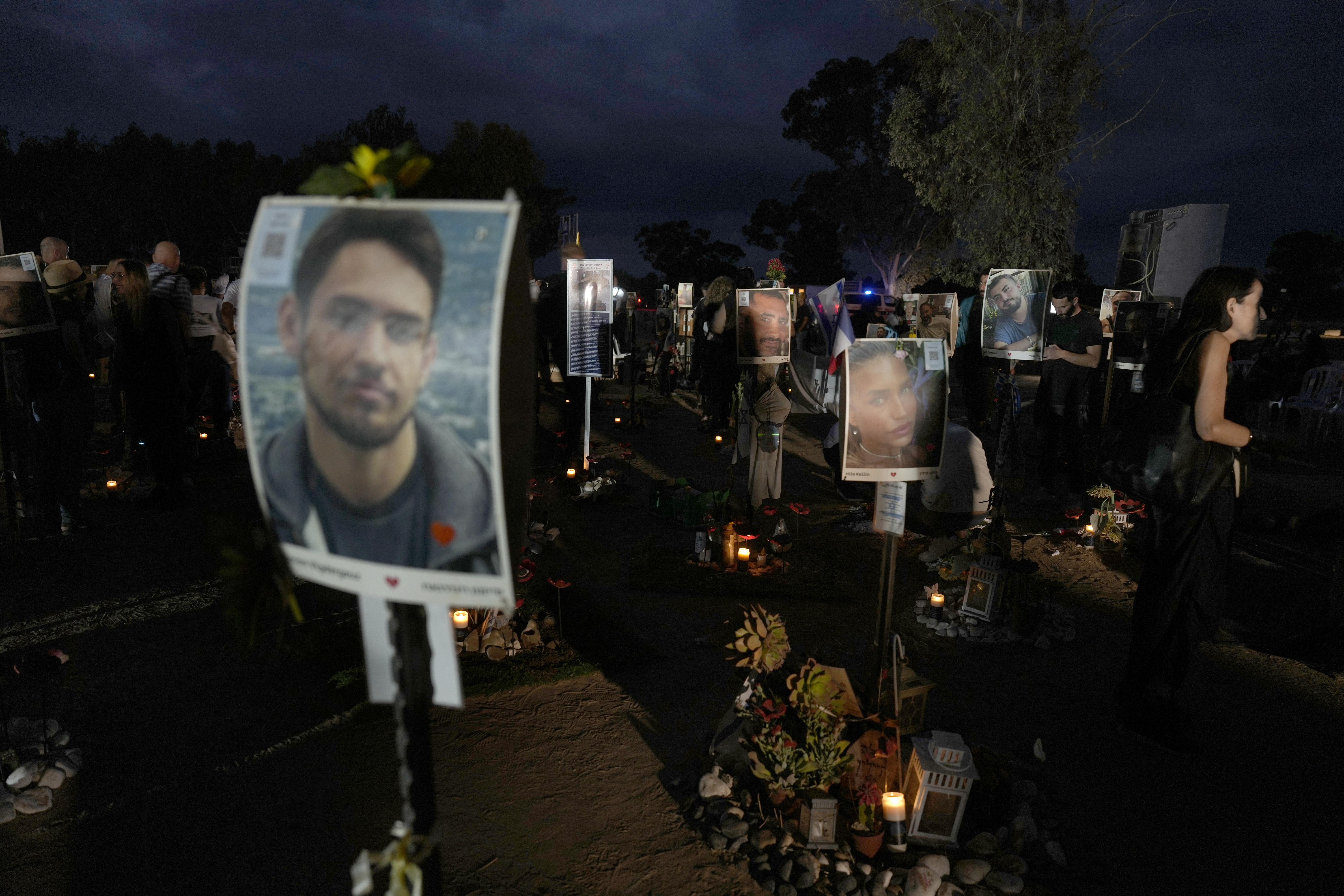 People visit the site of the Nova music festival, where hundreds of revelers were killed and abducted by Hamas and taken into Gaza, on the one-year anniversary of the attack, near Kibbutz Reim, southern Israel, Monday, Oct. 7, 2024. (AP Photo/Ariel Schalit)