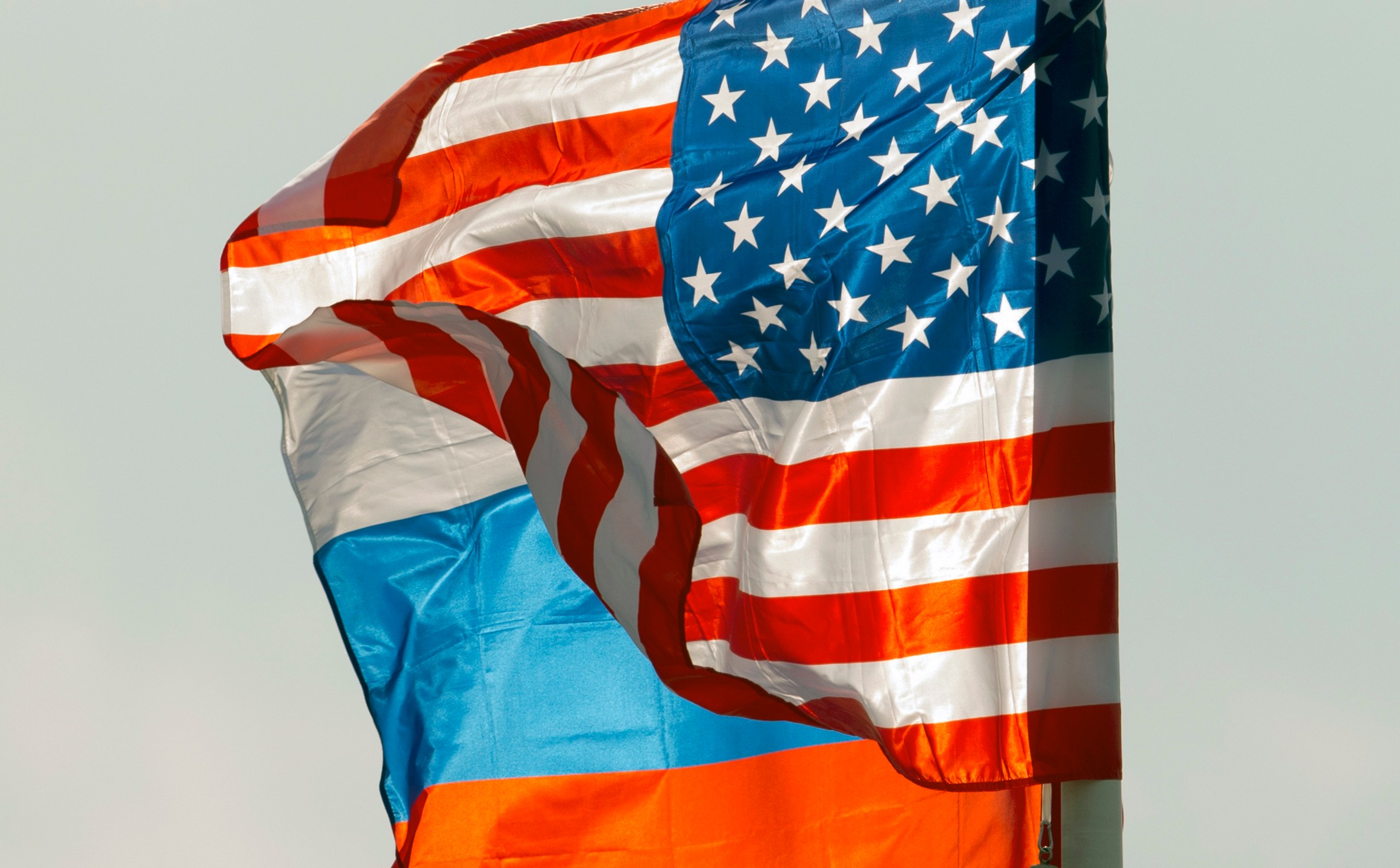 FILE - U.S. and Russian national flags wave on the wind in Moscow's Vnukovo airport, Russia, April 11, 2017 to welcome a U.S. dignitary. (AP Photo/ Ivan Sekretarev, file)