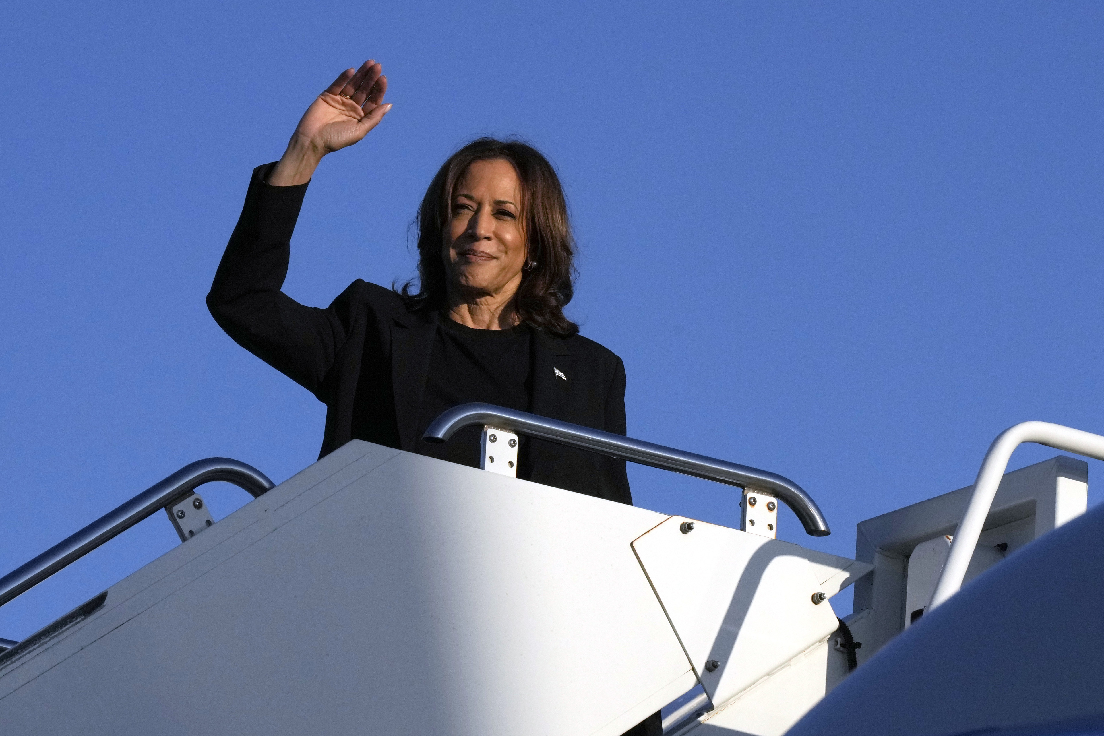 Democratic presidential nominee Vice President Kamala Harris boards Air Force Two at Charlotte Douglas International Airport, Saturday, October 5, 2024, in Charlotte, N.C., after a briefing on the damage from Hurricane Helene. (AP Photo/Chris Carlson)