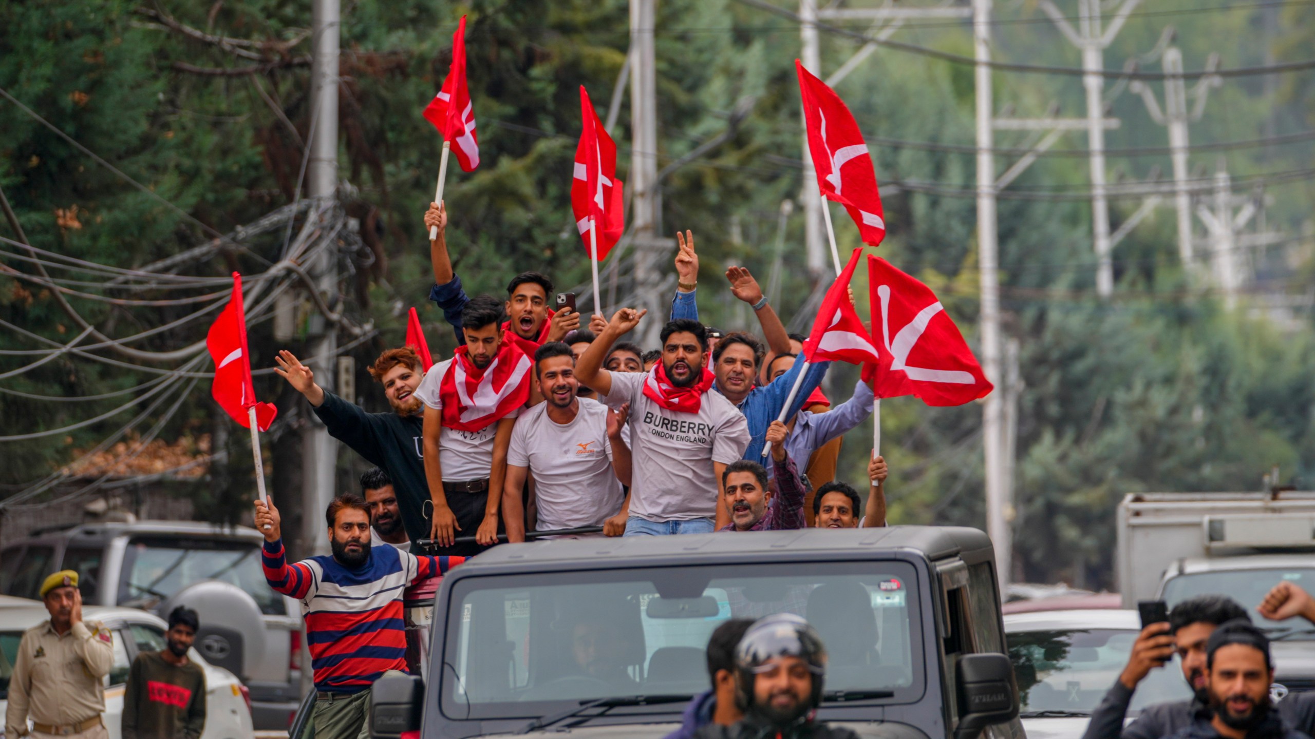 Supporters of National Conference party shout slogans as they celebrate early leads in the election for a local government in Indian controlled Kashmir, Srinagar, Tuesday, Oct. 8, 2024. (AP Photo/Dar Yasin)