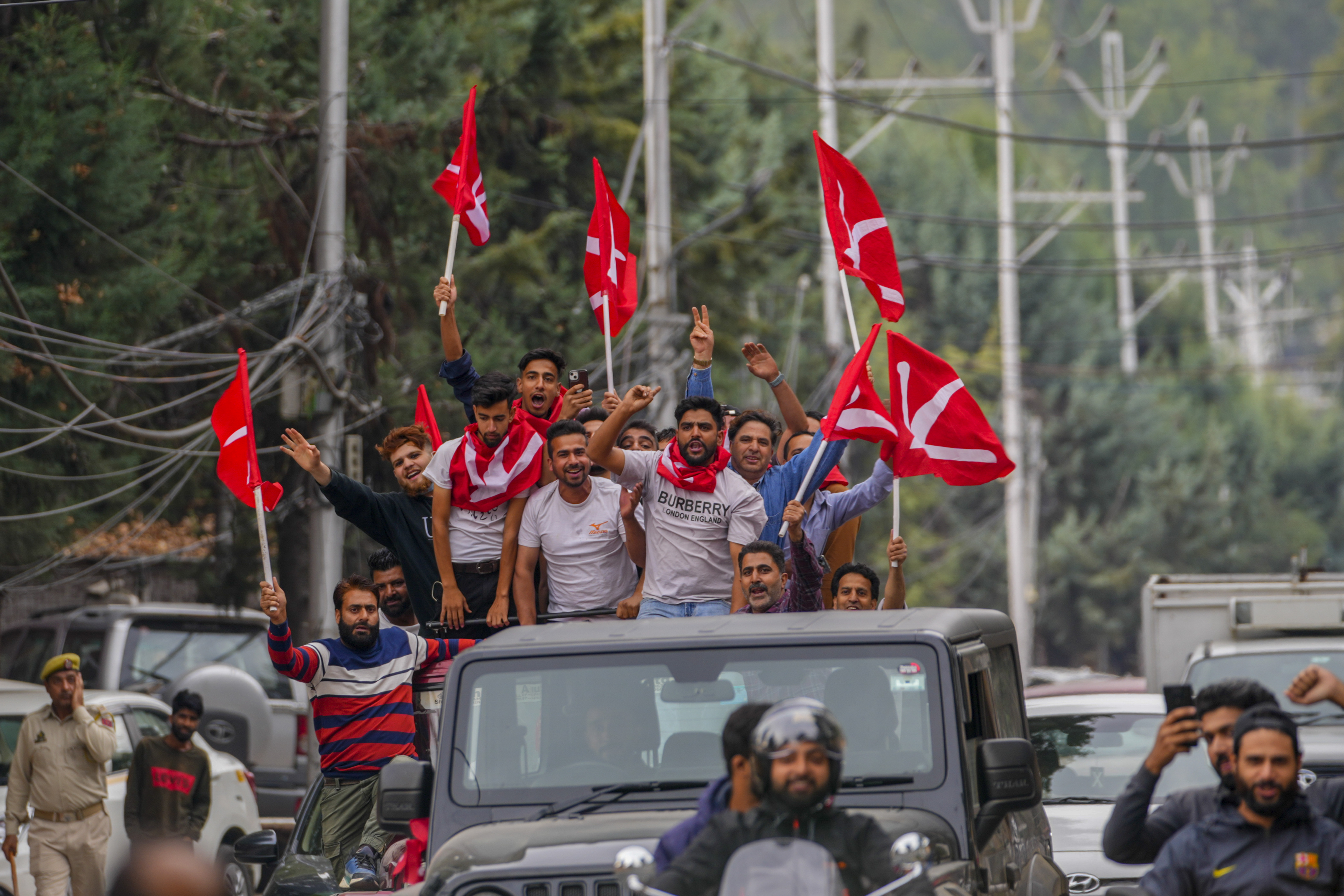 Supporters of National Conference party shout slogans as they celebrate early leads in the election for a local government in Indian controlled Kashmir, Srinagar, Tuesday, Oct. 8, 2024. (AP Photo/Dar Yasin)