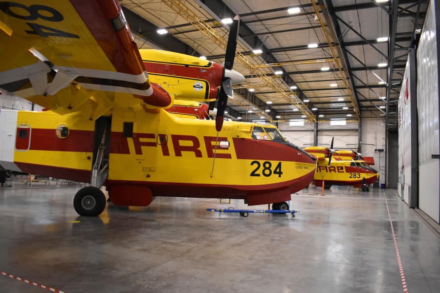 Firefighting aircraft known as "Super Scoopers" are seen inside a Bridger Aerospace hangar at Bozeman Yellowstone International Airport, Oct. 27, 2022, in Belgrade, Mont. (AP Photo/Matthew Brown)