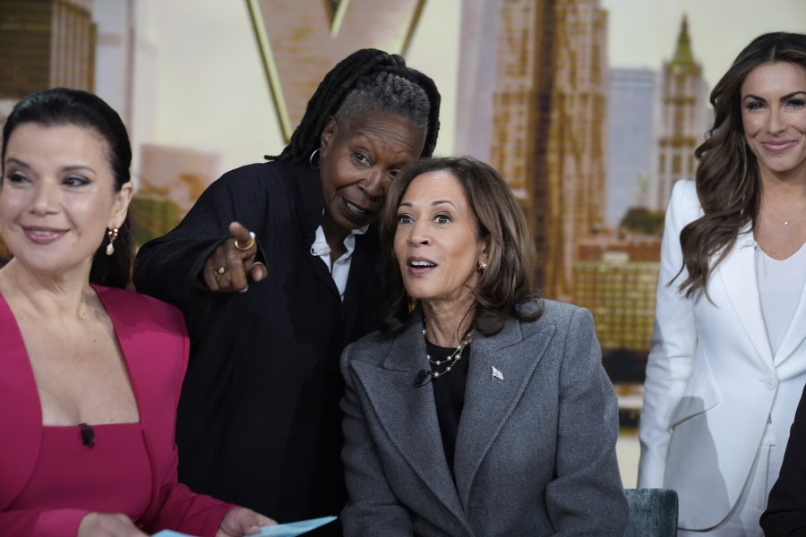 Democratic presidential nominee Vice President Kamala Harris chats with the hosts during a commercial break at The View, Tuesday, Oct. 8, 2024, in New York. From left are Ana Navarro, Whoopi Goldberg, Harris and Alyssa Farah Griffin. (AP Photo/Jacquelyn Martin)