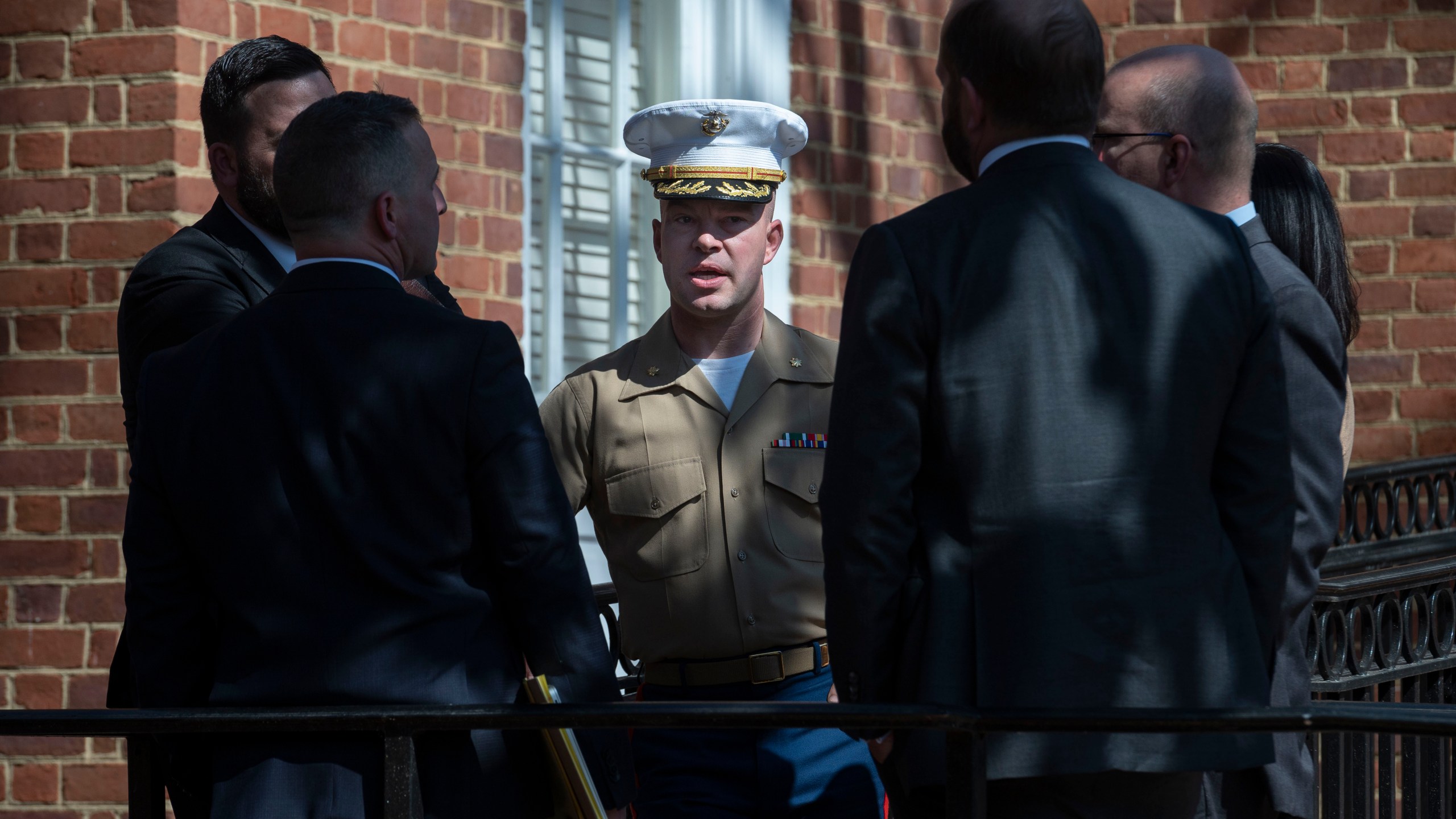 FILE - U.S. Marine Corp Major Joshua Mast, center, talks with his attorneys during a break in a hearing in an ongoing custody battle over an Afghan orphan, at the Circuit Courthouse in Charlottesville, Va., March 30, 2023. (AP Photo/Cliff Owen, File)