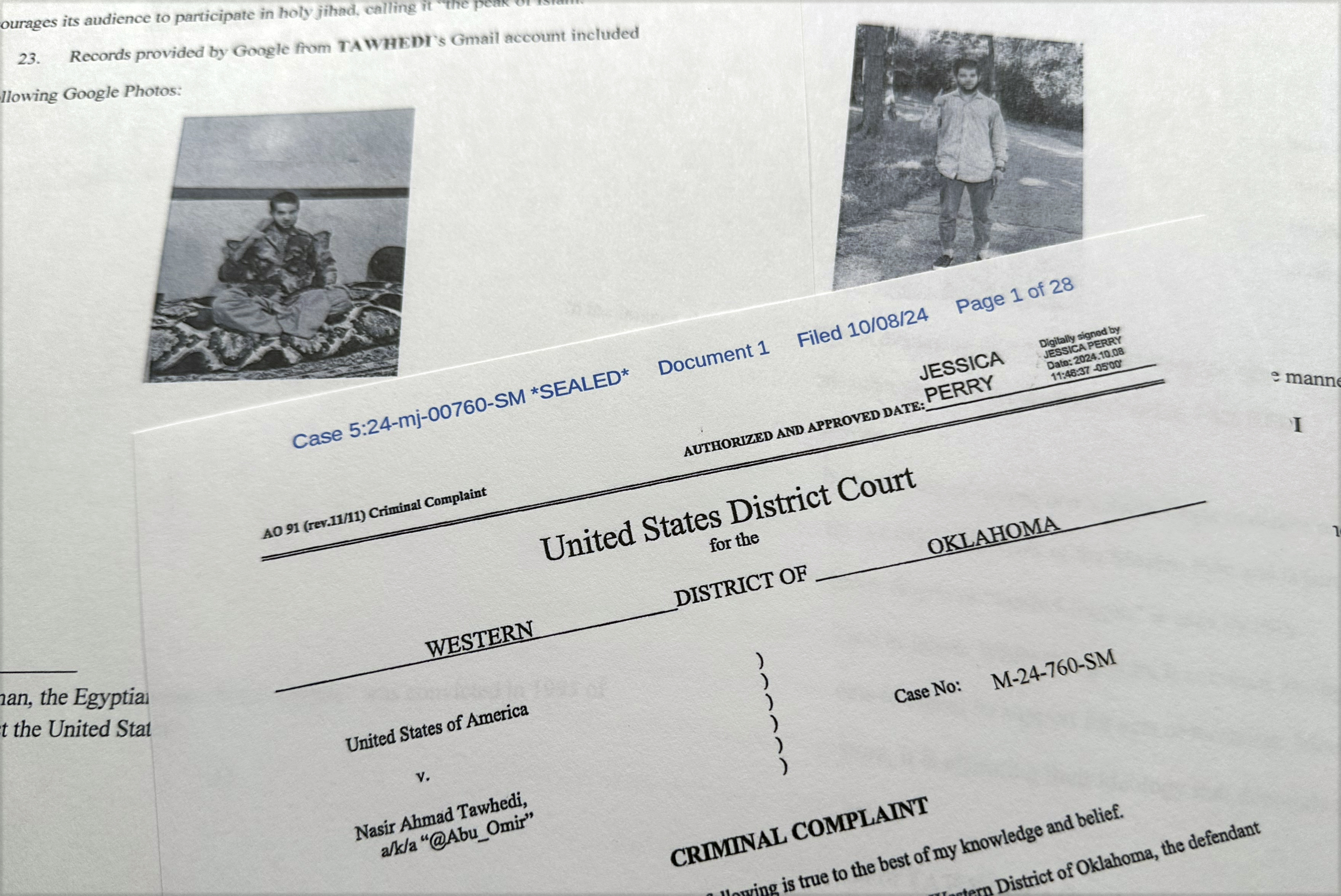 The criminal complaint, filed by the Justice Department, against Nasir Ahmad Tawhedi, 27,of Oklahoma City is photographed Tuesday, Oct. 8, after the FBI arrested the man who officials say was inspired by the Islamic State militant organization and was plotting an Election Day attack targeting large crowds in the U.S. (AP Photo/Jon Elswick)