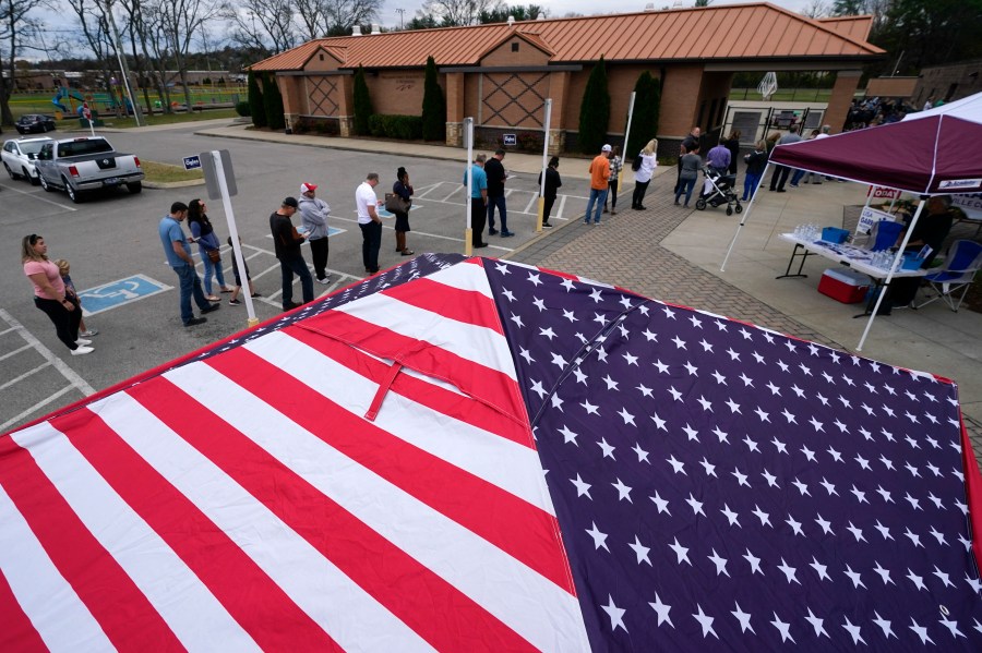 FILE - People line up to vote near tents set up by candidates' supporters, Nov. 8, 2022, in Nolensville, Tenn. (AP Photo/Mark Humphrey, File)