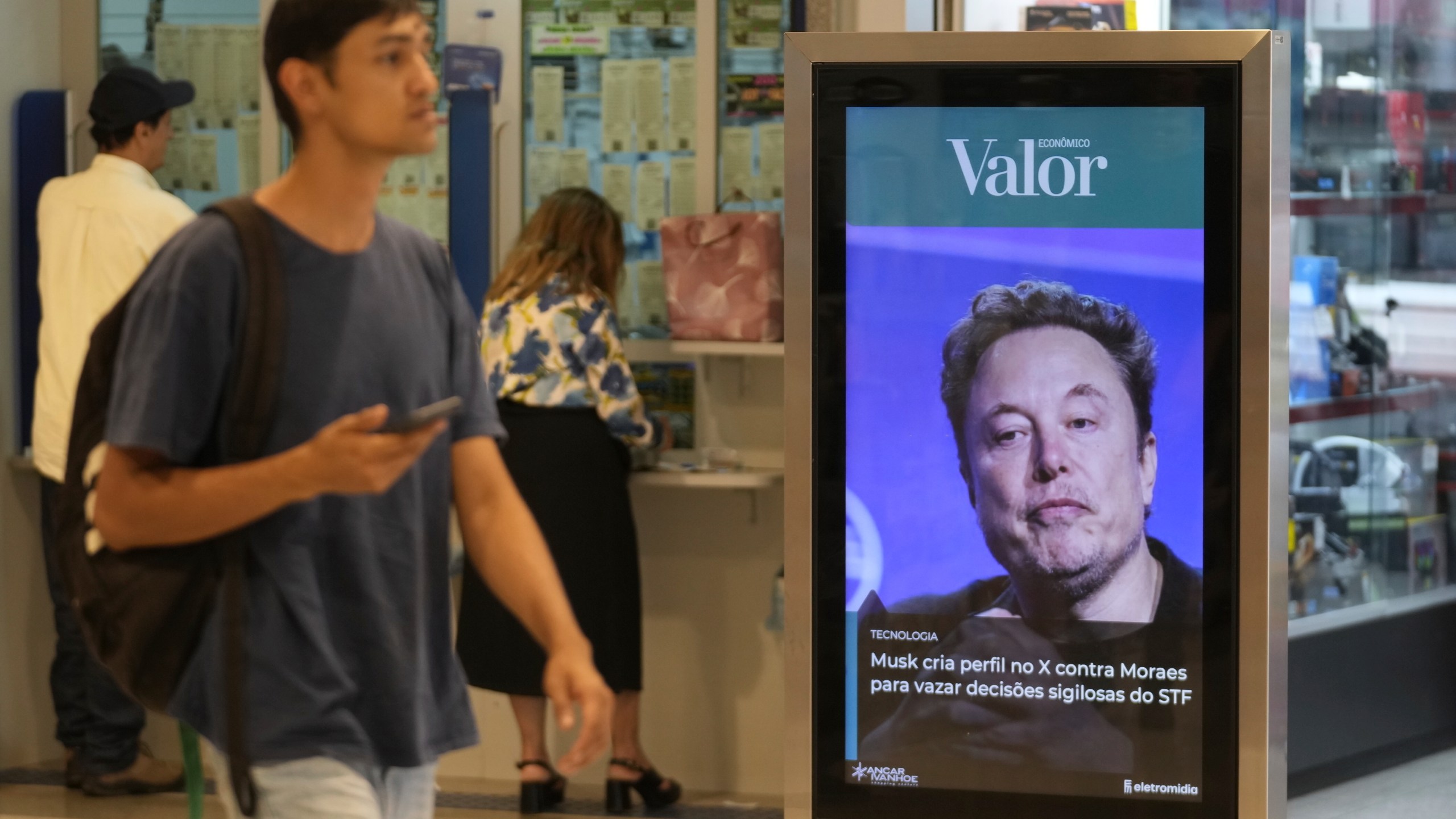 FILE - An ad by Valor media shows a photo of Elon Musk at a shopping center in Brasilia, Brazil, Monday, Sept. 2, 2024. (AP Photo/Eraldo Peres, File)