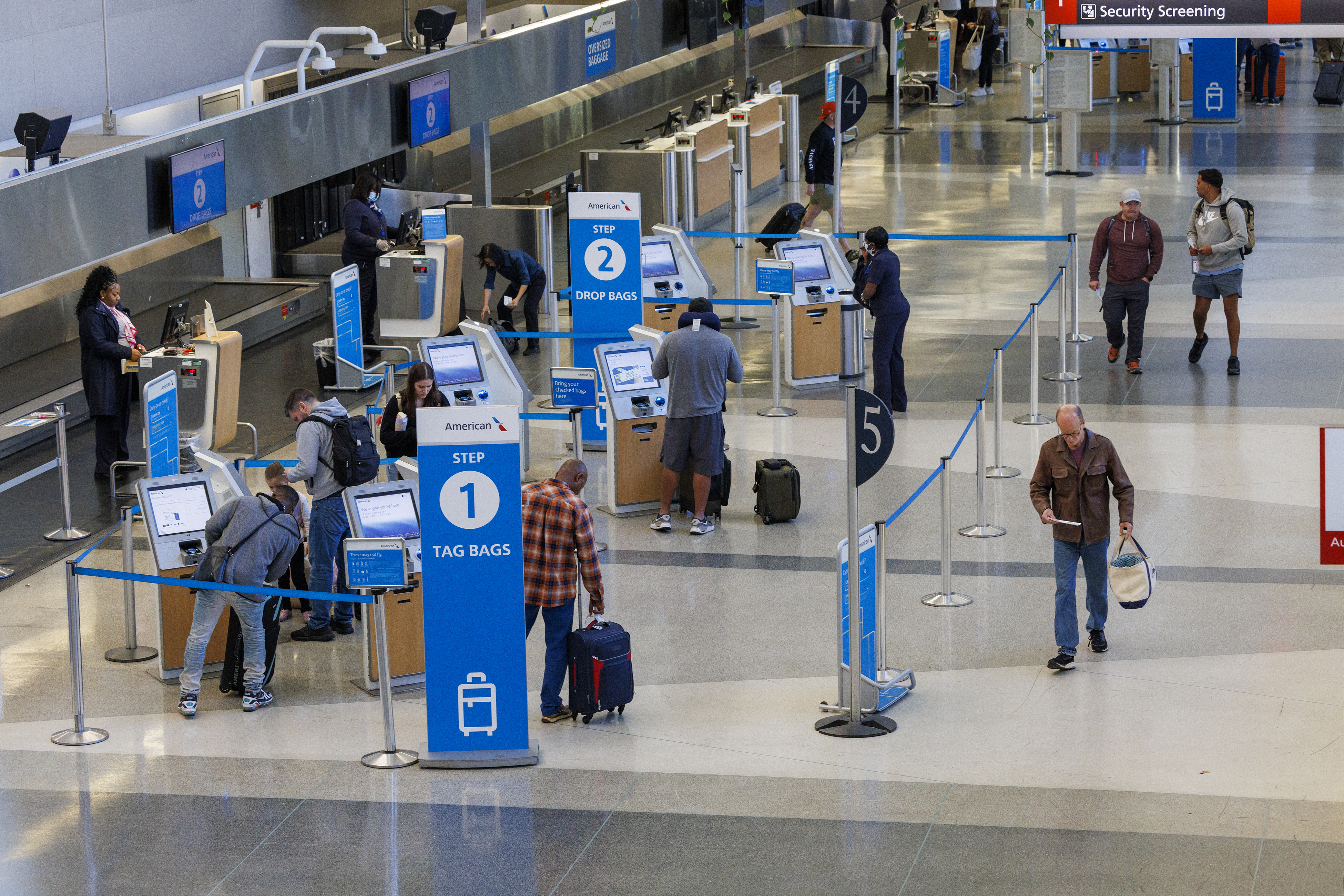 Travelers check in as flights to Tampa, Fla., are canceled due to Hurricane Milton on Wednesday, Oct. 9, 2024 at the Philadelphia International Airport. (Alejandro A. Alvarez/The Philadelphia Inquirer via AP)