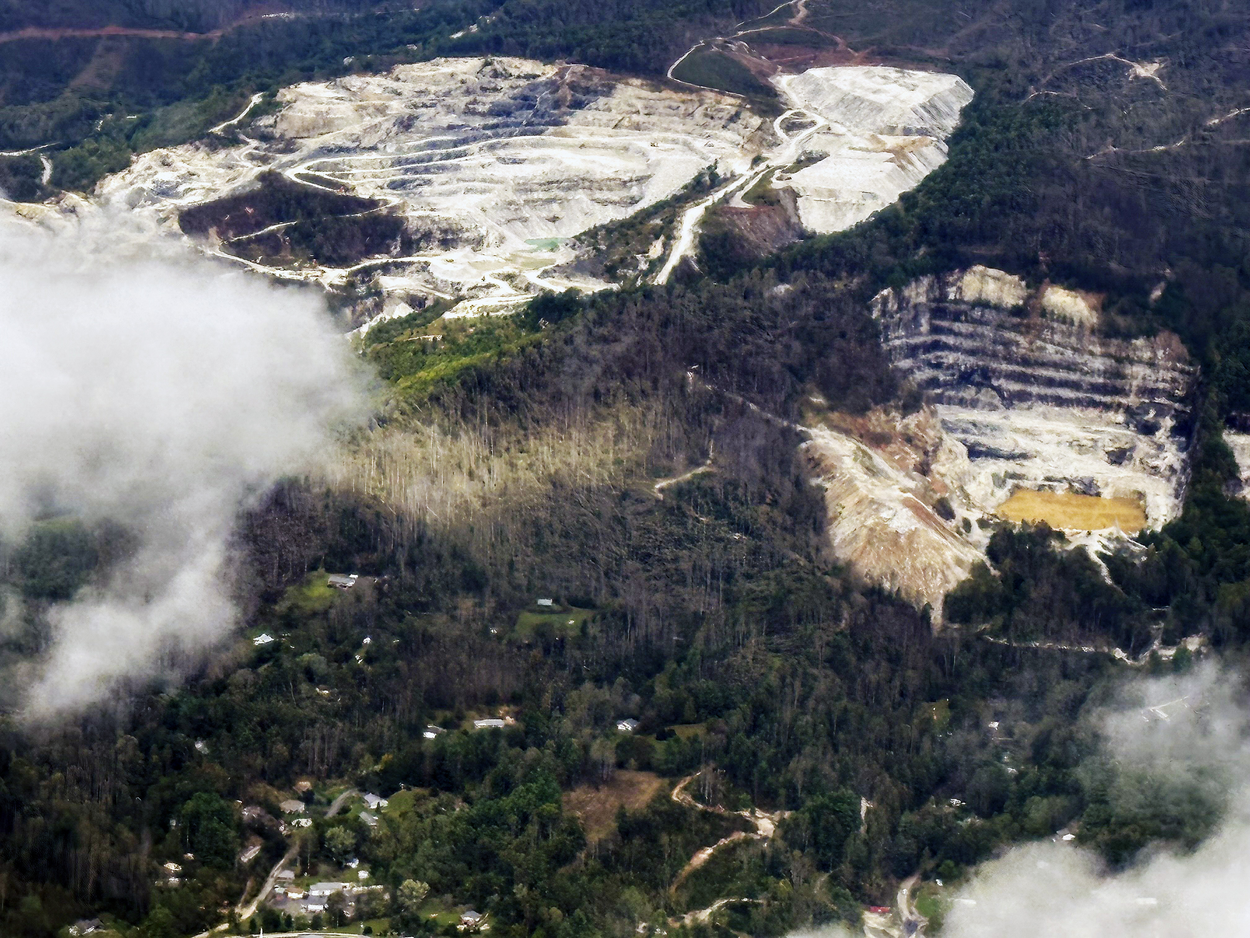 An aerial view of quartz mines in Spruce Pine, N.C., as taken from a plane on Monday, Sept. 30, 2024. (AP Photo/Gary D. Robertson)