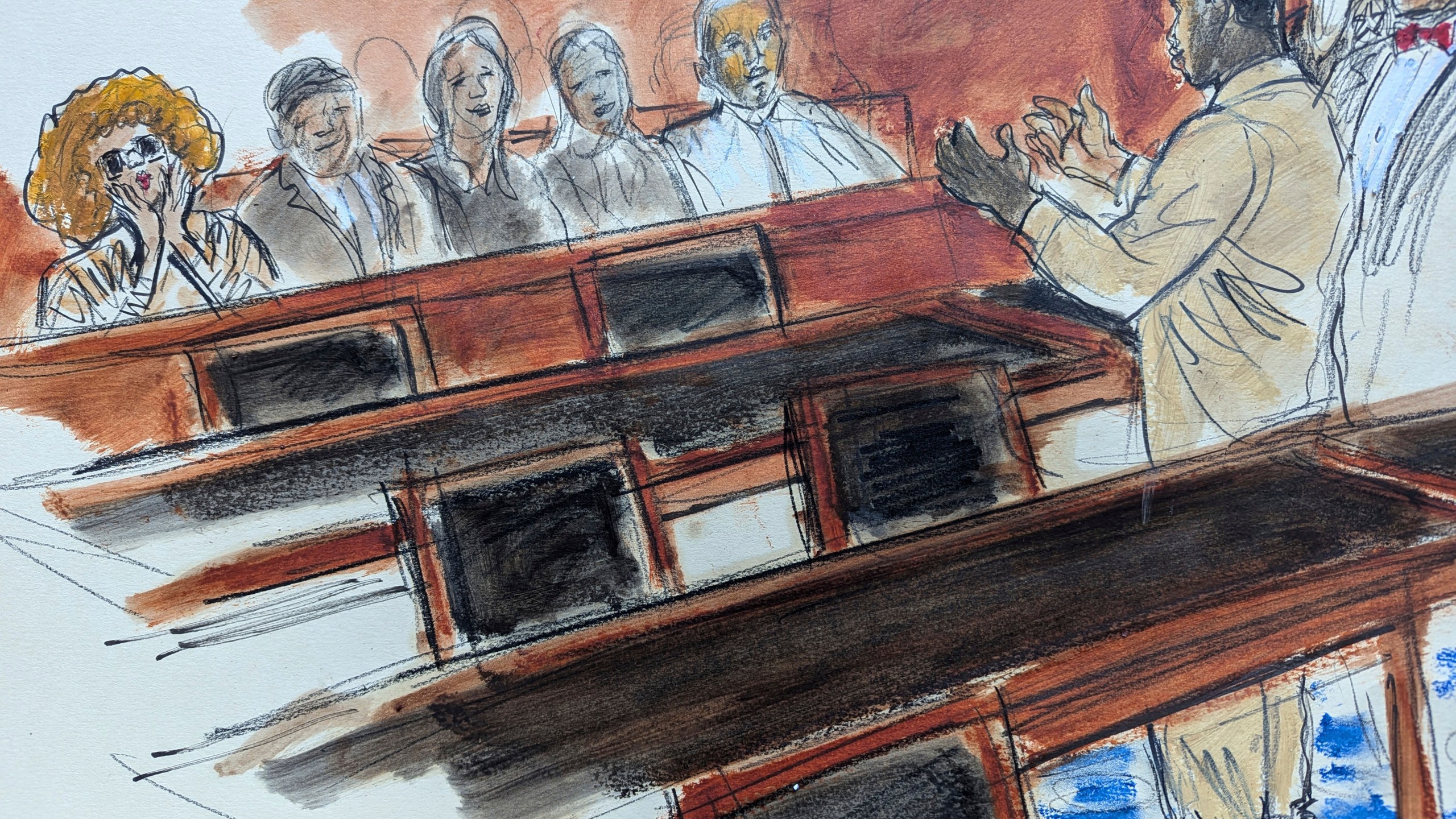 In this courtroom sketch, Sean "Diddy" Combs, right, in shackles, gestures to his mother, seated in the audience far left, who is blowing kisses to him following his hearing in federal court in New York, Thursday, Oct. 10, 2024. (Elizabeth Williams via AP)