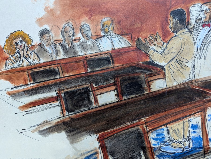 In this courtroom sketch, Sean "Diddy" Combs, right, in shackles, gestures to his mother, seated in the audience far left, who is blowing kisses to him following his hearing in federal court in New York, Thursday, Oct. 10, 2024. (Elizabeth Williams via AP)