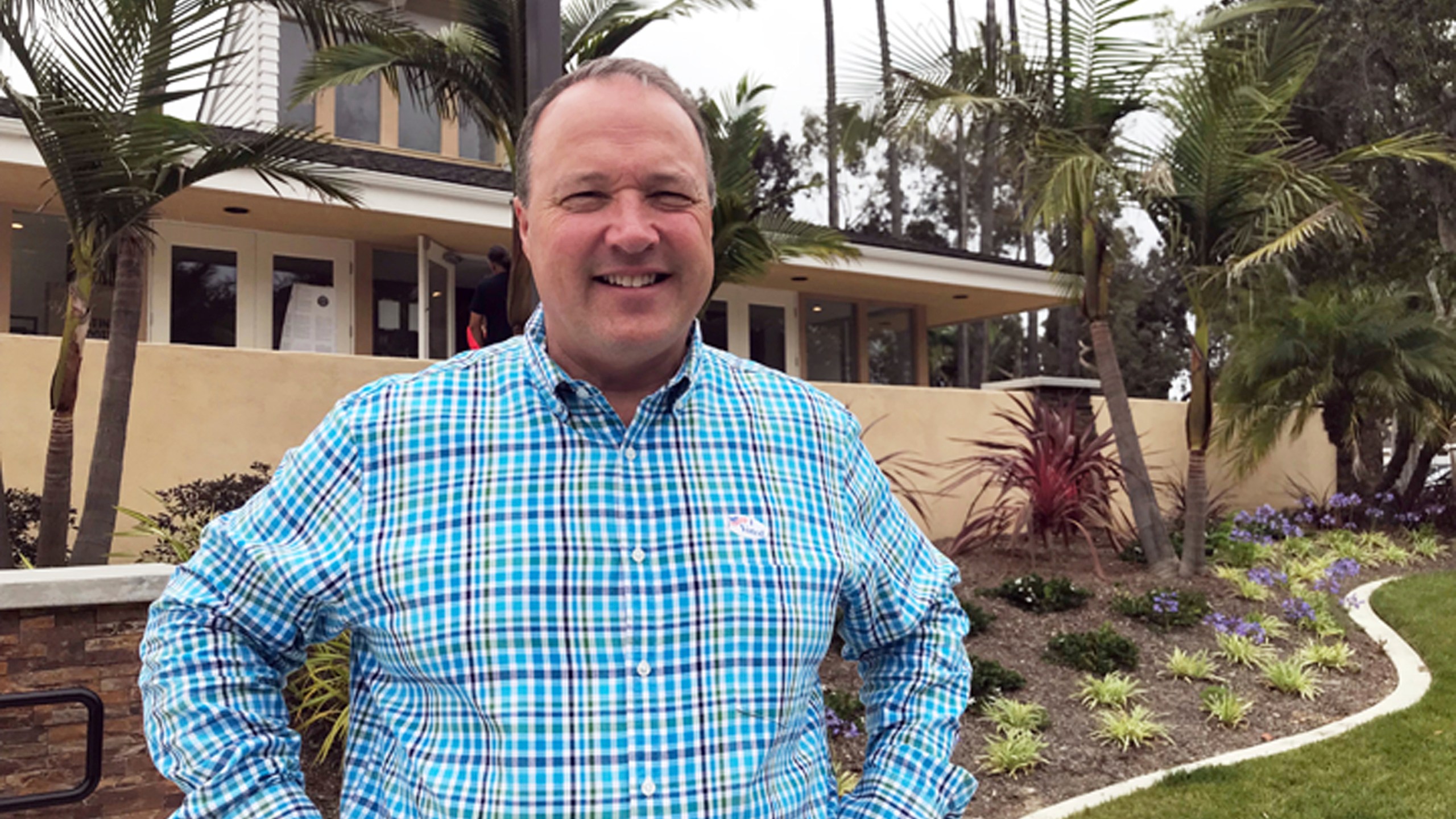 FILE - Scott Baugh, a Republican candidate for Congress from Orange County's 48th District, poses outside a polling place after voting in Huntington Beach, Calif., June 5, 2018. (AP Photo/Krysta Fauria, File)