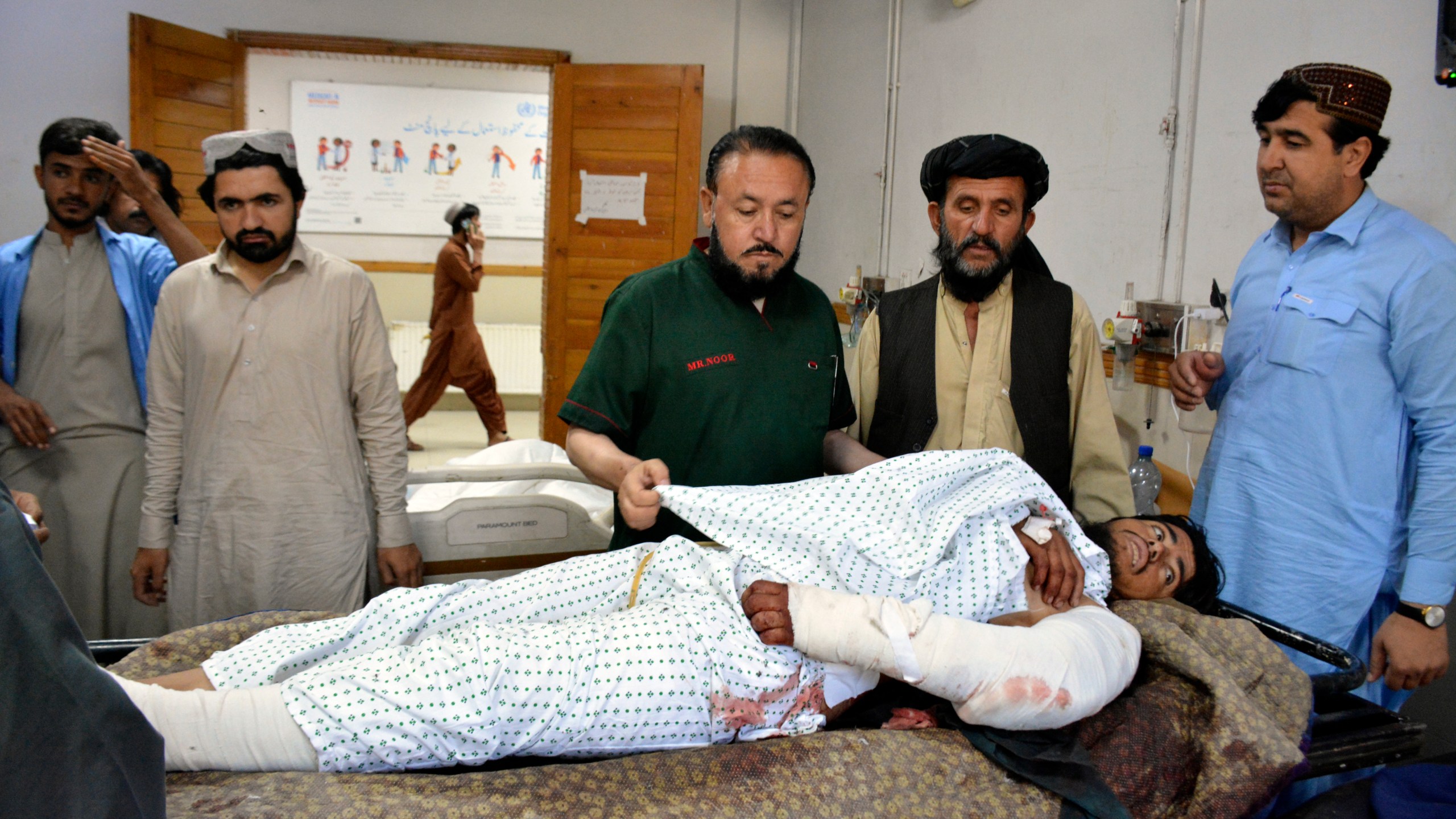 An injured man receives treatment at a hospital in Quetta, Pakistan, Friday, Oct. 11, 2024, following Thursday attack by gunmen in Balochistan province. (AP Photo/Arshad Butt)