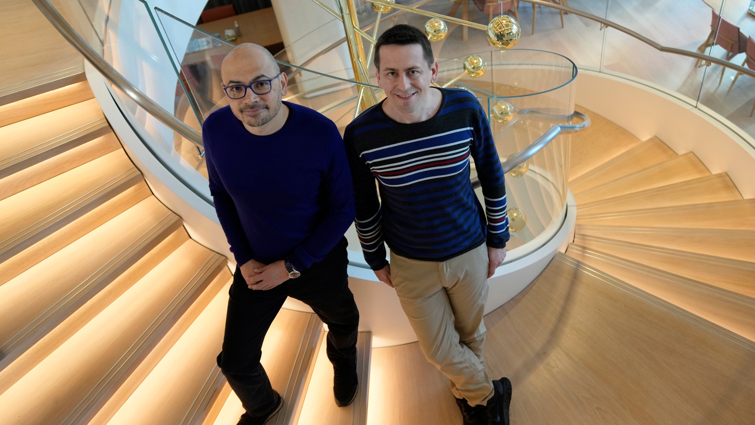 Researcher John Jumper, left, and Demis Hassabis, CEO of DeepMind Technologies, the AI division behind Gemini, speak to Associated Press at the Google DeepMind offices in London, Wednesday, Oct. 9, 2024 after being awarded with the Nobel Prize in Chemistry.(AP Photo/Alastair Grant)