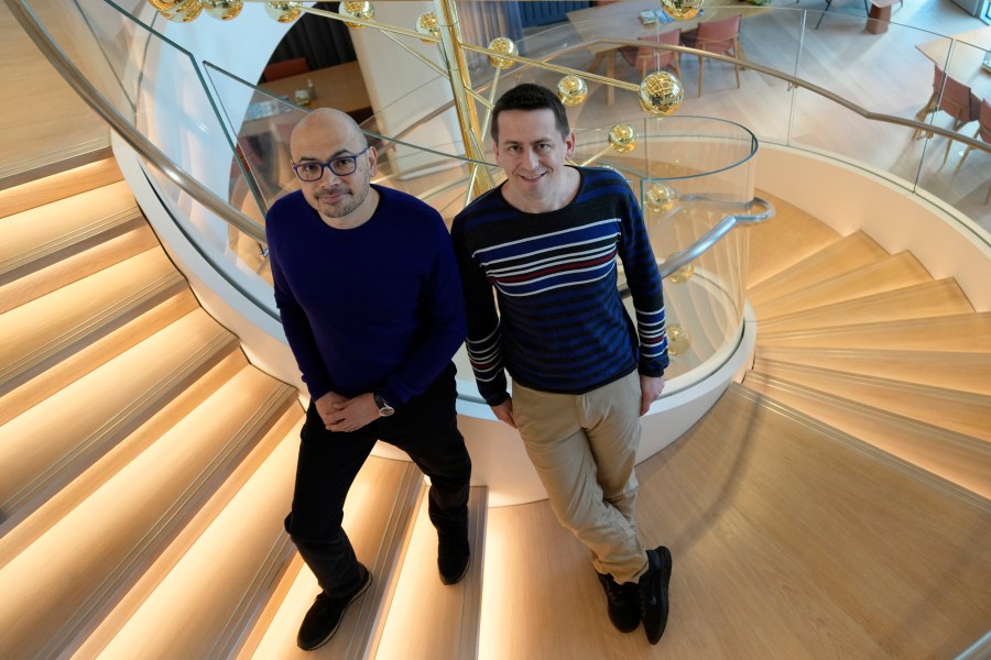 Researcher John Jumper, left, and Demis Hassabis, CEO of DeepMind Technologies, the AI division behind Gemini, speak to Associated Press at the Google DeepMind offices in London, Wednesday, Oct. 9, 2024 after being awarded with the Nobel Prize in Chemistry.(AP Photo/Alastair Grant)