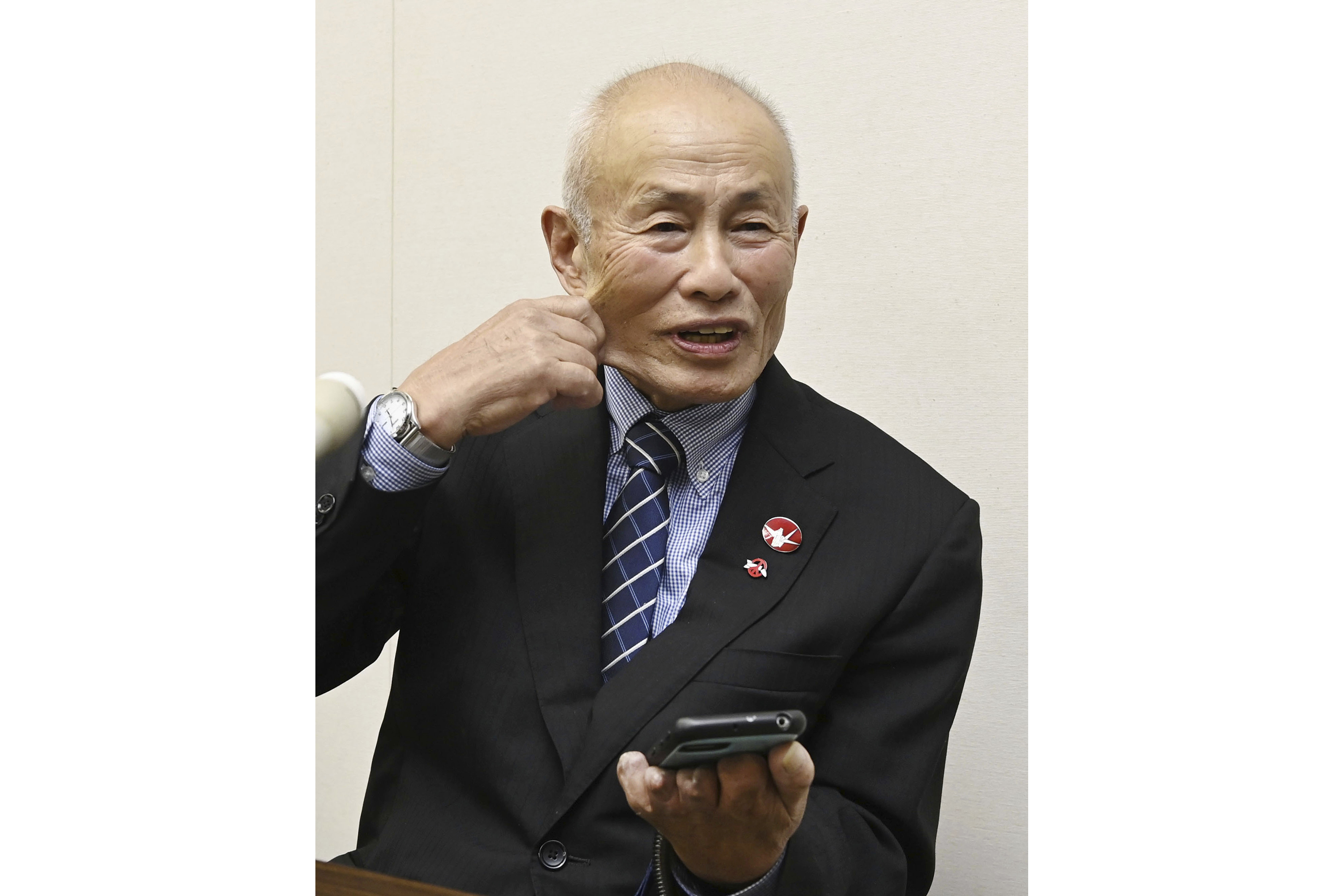 Toshiyuki Mimaki, president of Nihon Hidankyo, or the Japan Confederation of A- and H-Bomb Sufferers Organizations, reacts as he speaks to media members in Hiroshima, western Japan, Friday, Oct. 11, 2024, following Nihon Hidankyo's winning the Nobel Peace Prize. (Moe Sasaki/Kyodo News via AP)