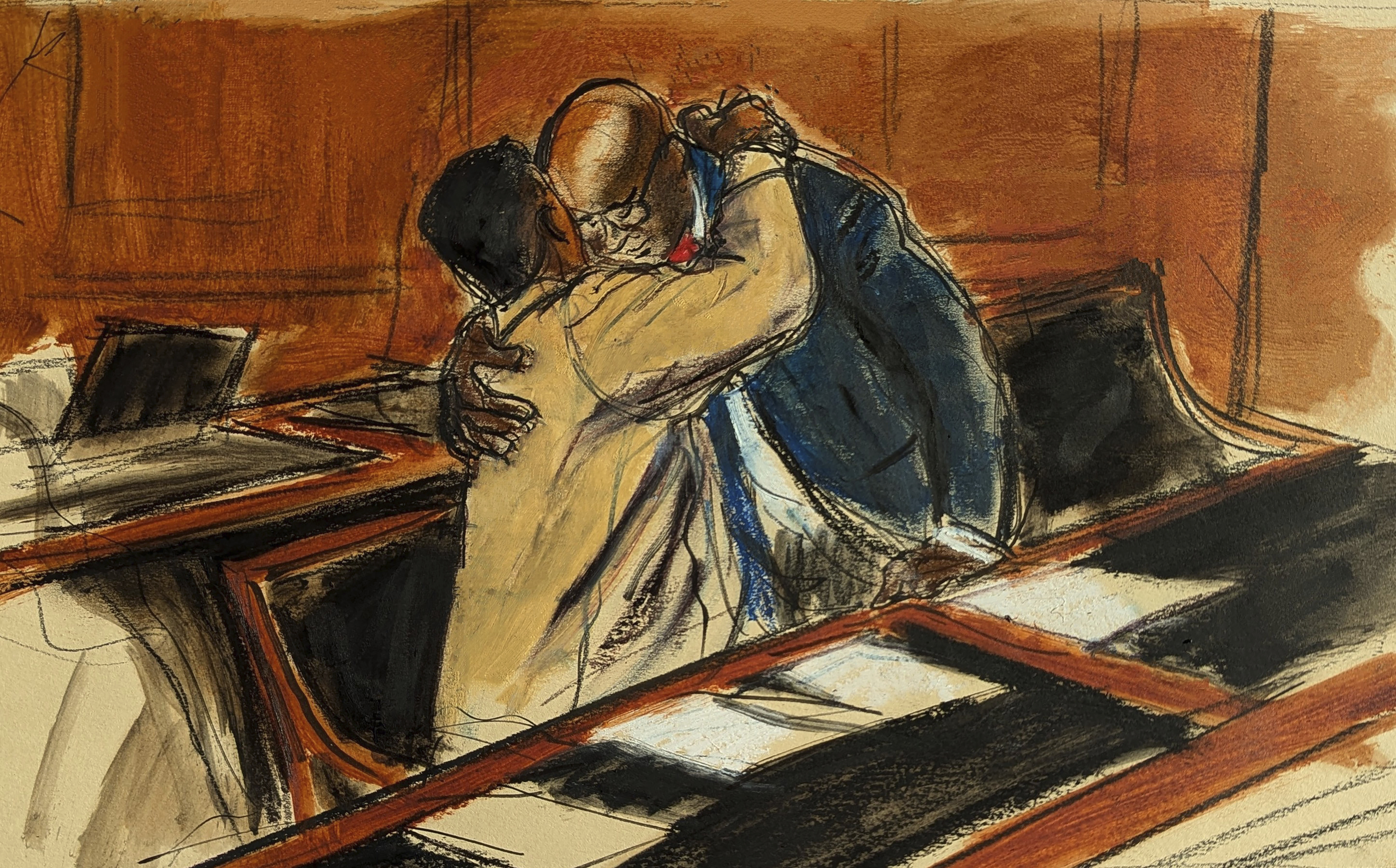 In this courtroom sketch, Sean "Diddy" Combs, left, upon entering the courtroom hugs his attorney Anthony Ricco prior to the hearing in Federal court in New York, Thursday, Oct. 10, 2024. (Elizabeth Williams via AP)