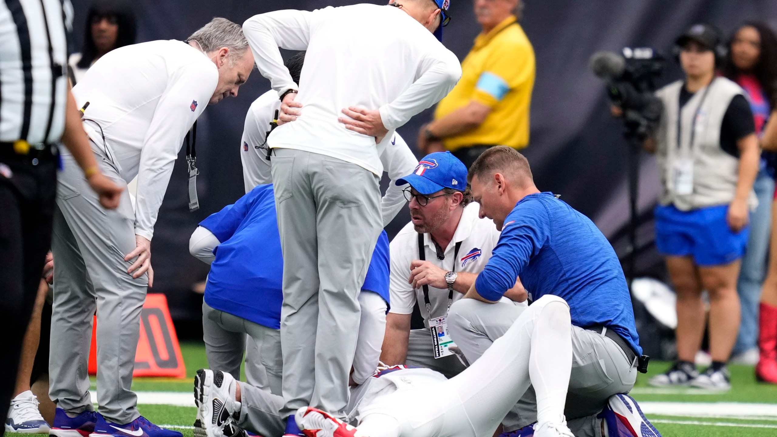 Buffalo Bills quarterback Josh Allen is looked at by trainers after getting injured during the second half of an NFL football game against the Houston Texans, Sunday, Oct. 6, 2024, in Houston. (AP Photo/Eric Christian Smith)