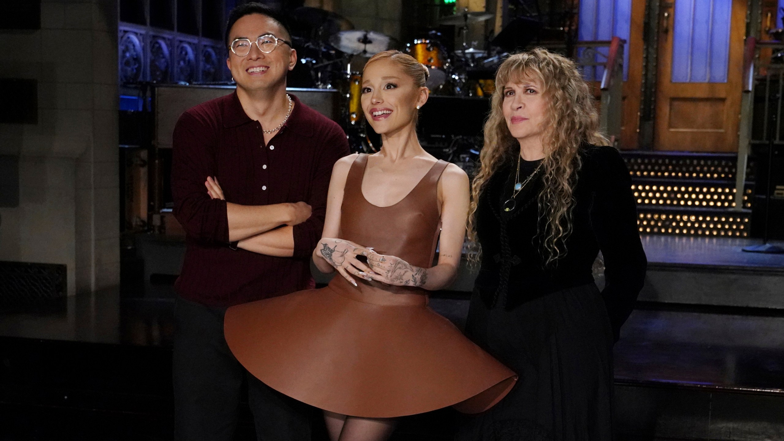 This image released by NBC shows cast member Bowen Yang, from left, host Ariana Grande, and musical guest Stevie Nicks during promos for the upcoming "Saturday Night Live" broadcast in New York on Thursday, Oct. 10, 2024. (Rosalind O'Connor/NBC via AP)