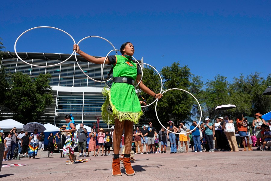 FILE - Performers from the Native American Hoop Dance of Ballet Arizona dance at an Indigenous Peoples Day festival, Oct. 9, 2023, in Phoenix. (AP Photo/Ross D. Franklin, File)