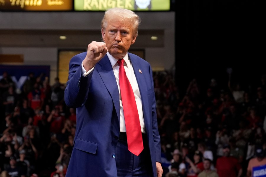 Republican presidential nominee former President Donald Trump gestures at a campaign rally at the Findlay Toyota Arena Sunday, Oct. 13, 2024, in Prescott Valley, Ariz. (AP Photo/Evan Vucci)