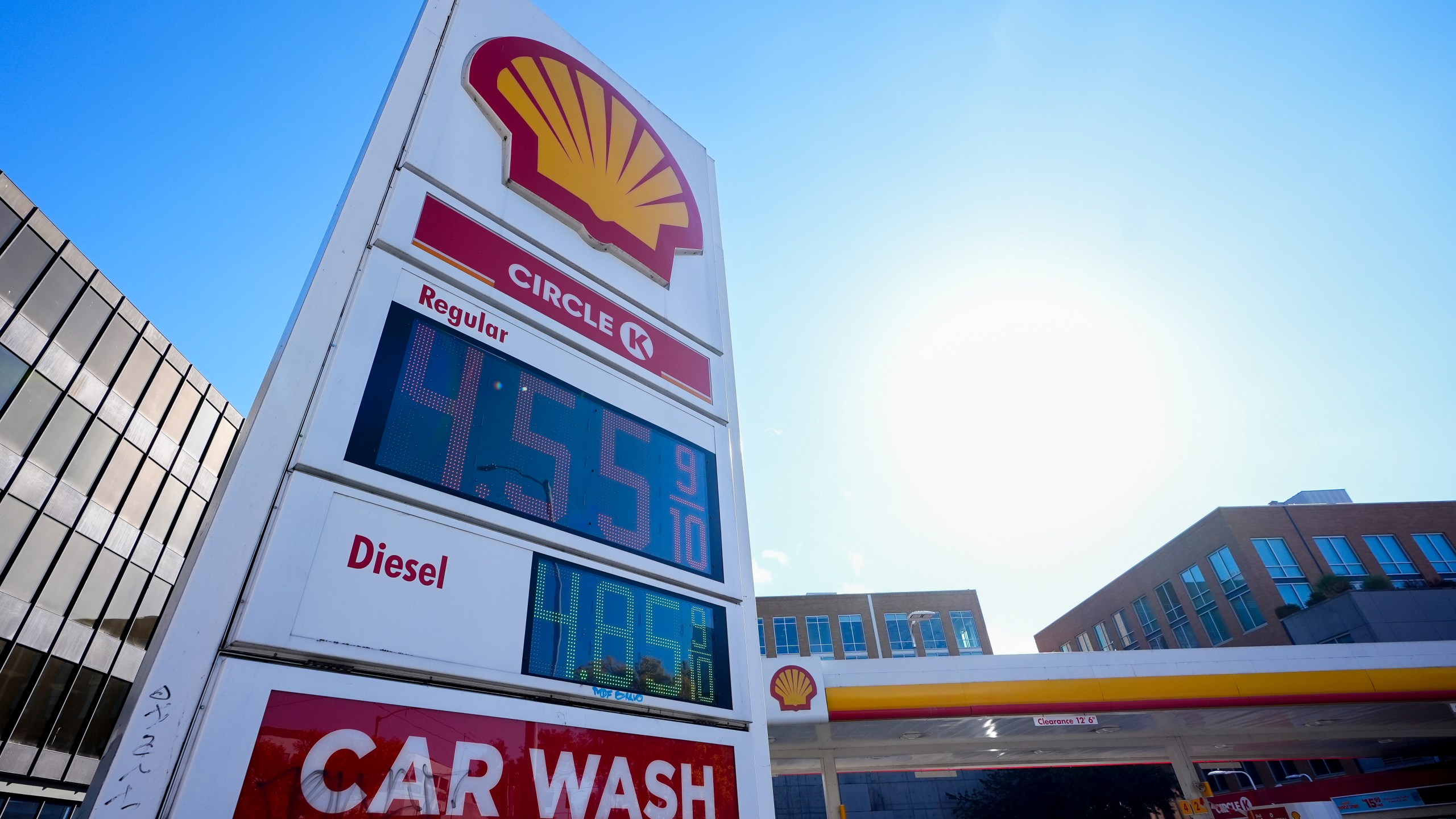 Prices are displayed on a corner sign at a Shell gas station, Wednesday, Oct. 9, 2024, in Seattle. (AP Photo/Lindsey Wasson)