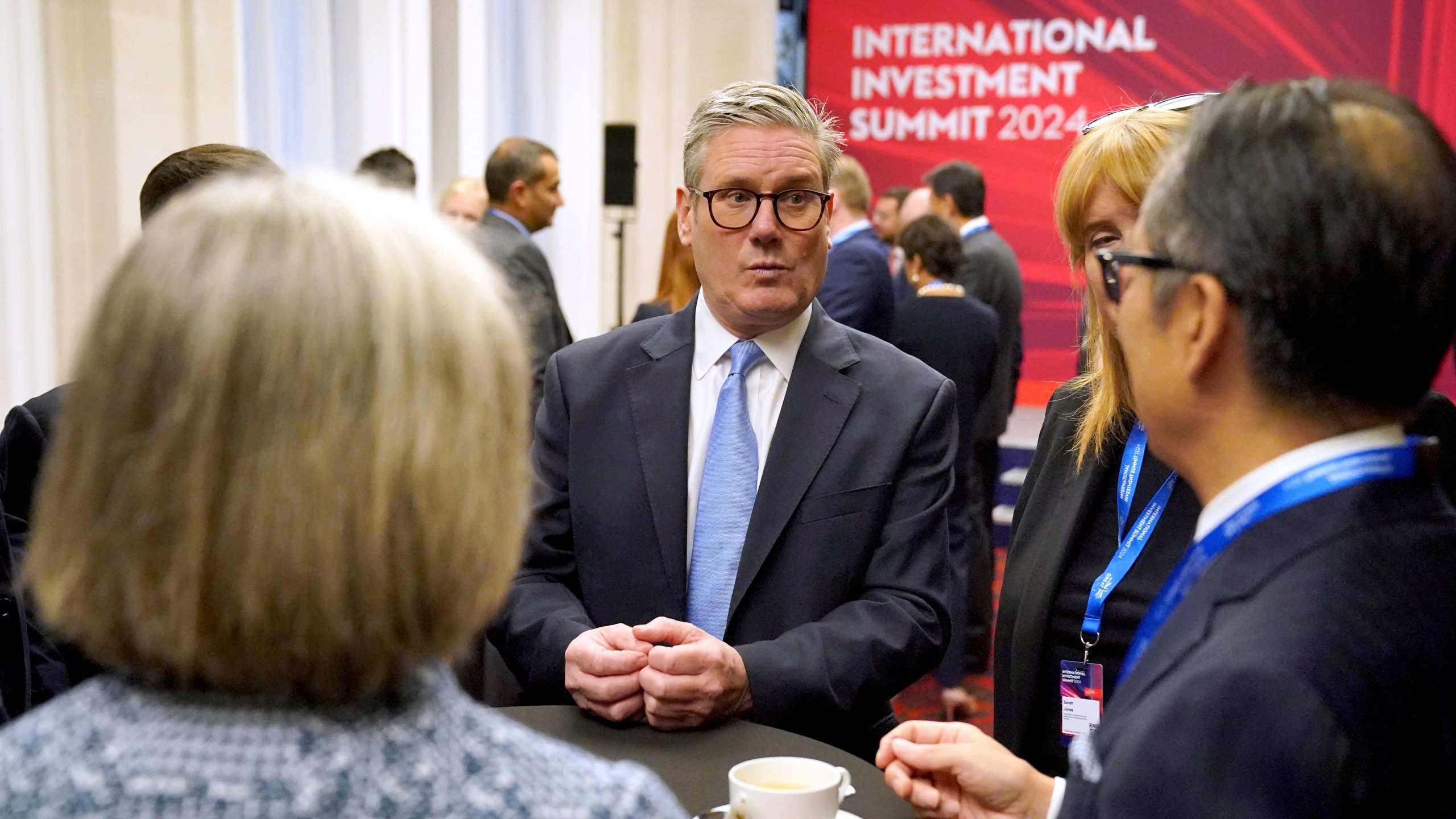 British Prime Minister Sir Keir Starmer, center, speaks with leaders from across the UK during the International Investment Summit in London, Monday, Oct. 14, 2024. (Jonathan Brady/Pool Photo via AP)