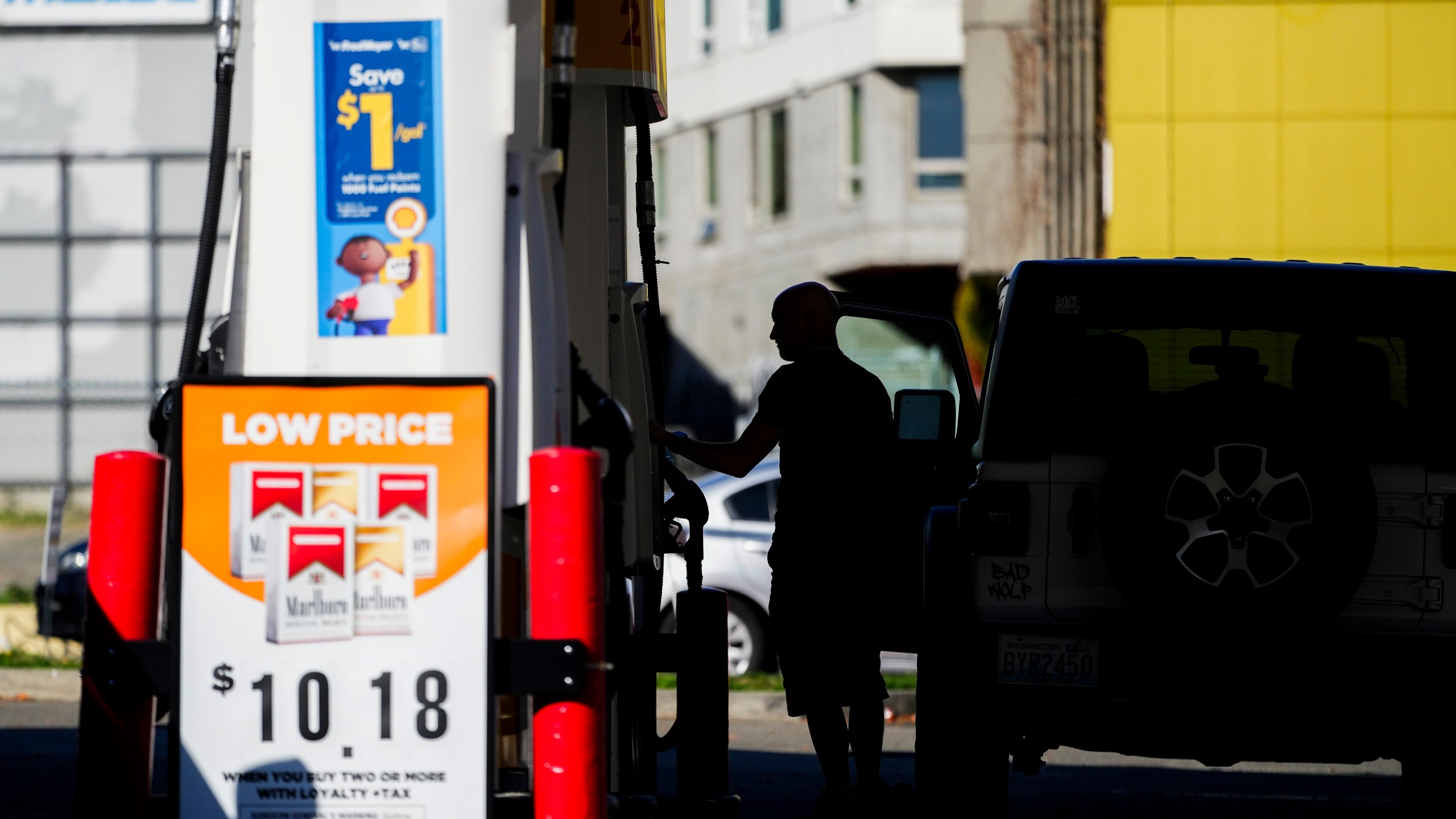 A driver fills up at a pump at a Shell gas station, Wednesday, Oct. 9, 2024, in Seattle. (AP Photo/Lindsey Wasson)